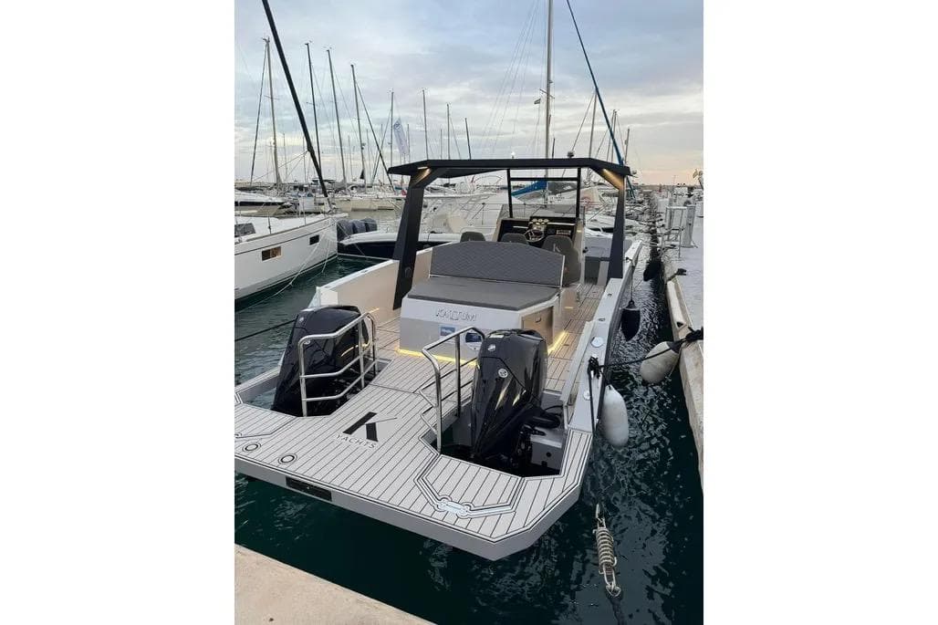 2024 Kattum Yachts K30 docked at marina, showcasing sleek design and modern features.
