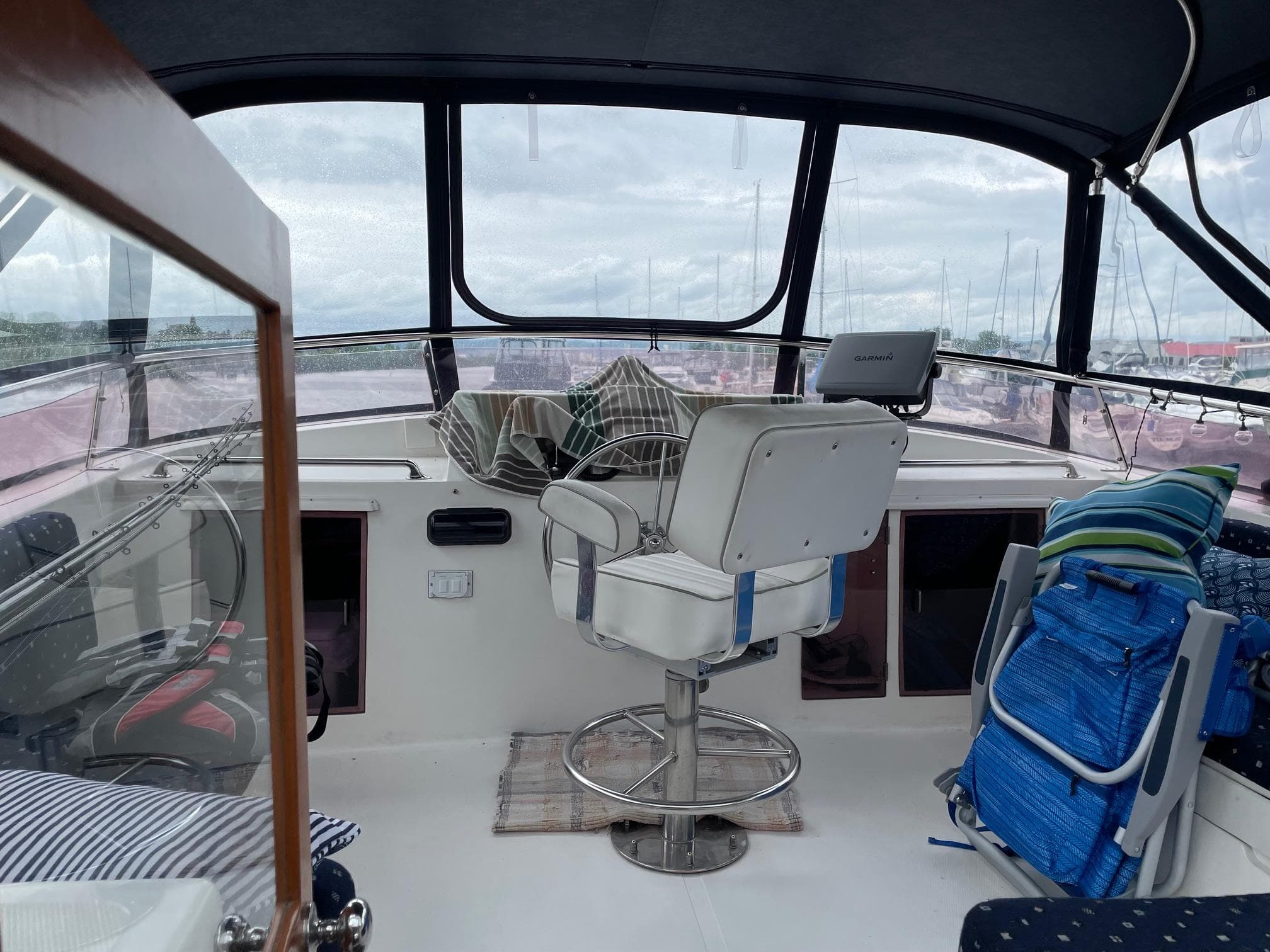1989 Marine Trader 47 CMY cockpit with captain's chair and panoramic windows.