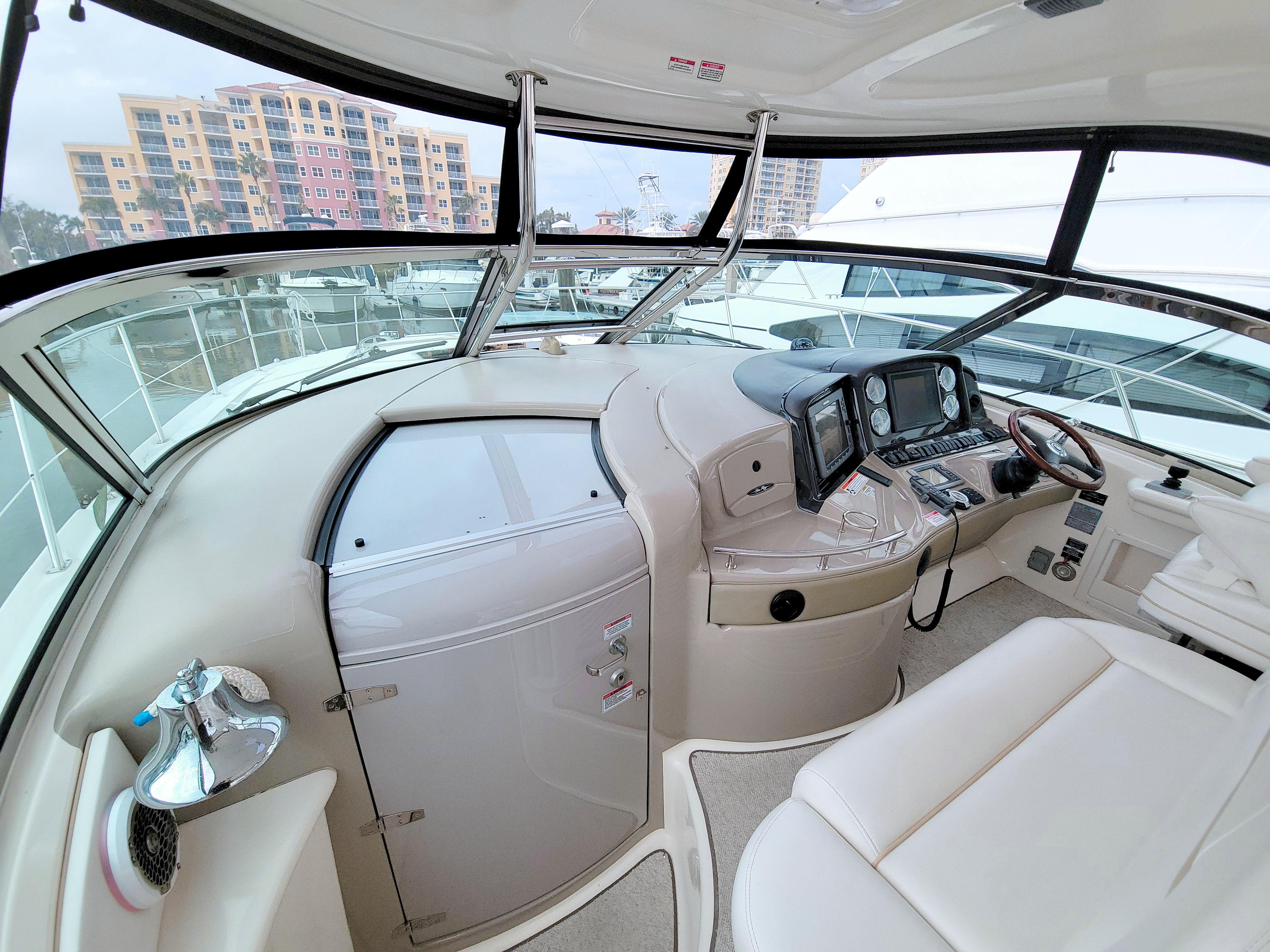 2009 Sea Ray 44 Sundancer helm with modern controls and panoramic windows.