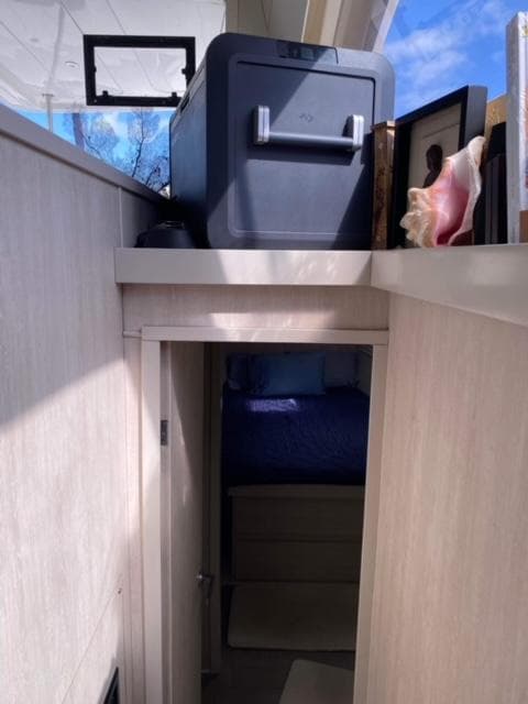 Interior of 2016 Leopard 48 yacht with storage and bedroom access.