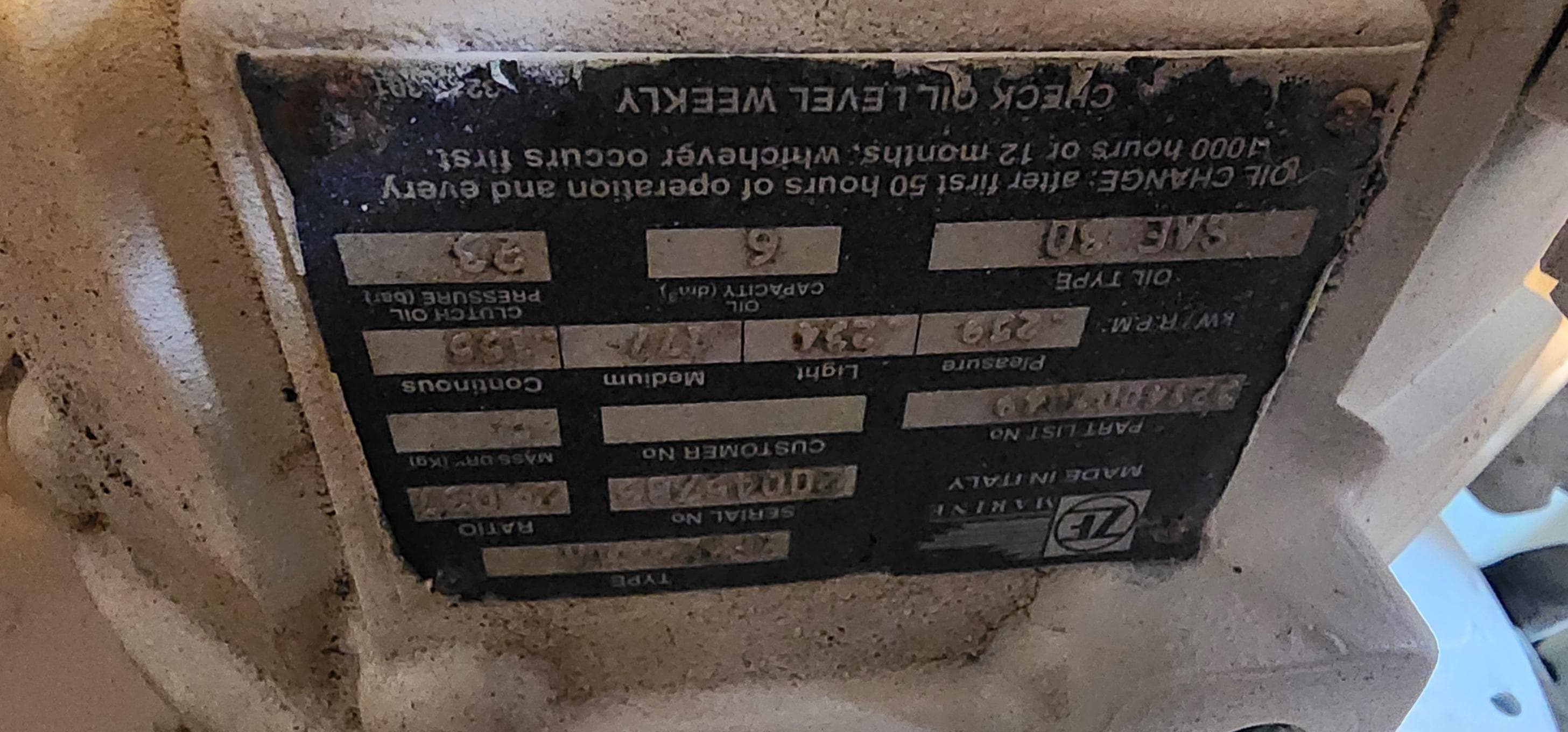 Close-up of a 2004 Silverton 48 Convertible engine label with maintenance instructions.
