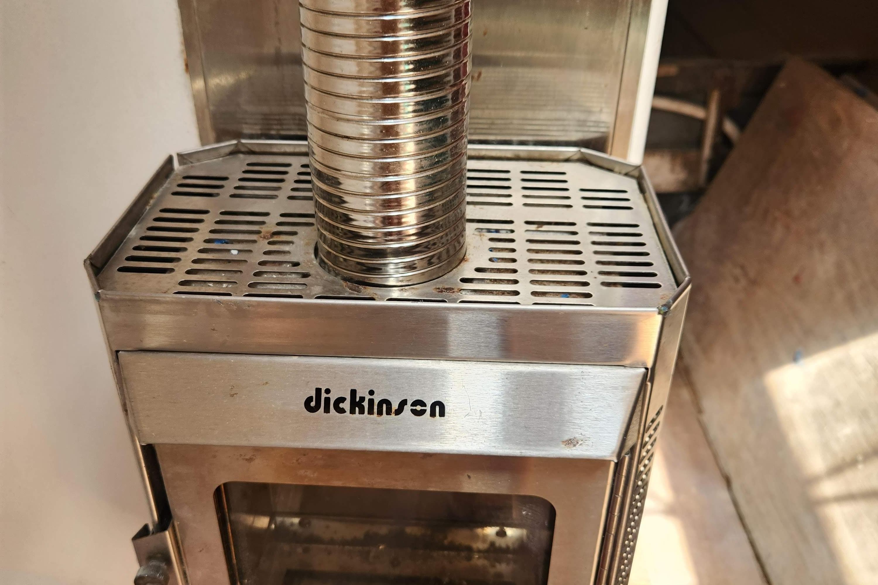 Stainless steel Dickinson stove on a 1959 Geerd Hendel Raised-Deck Cutter.