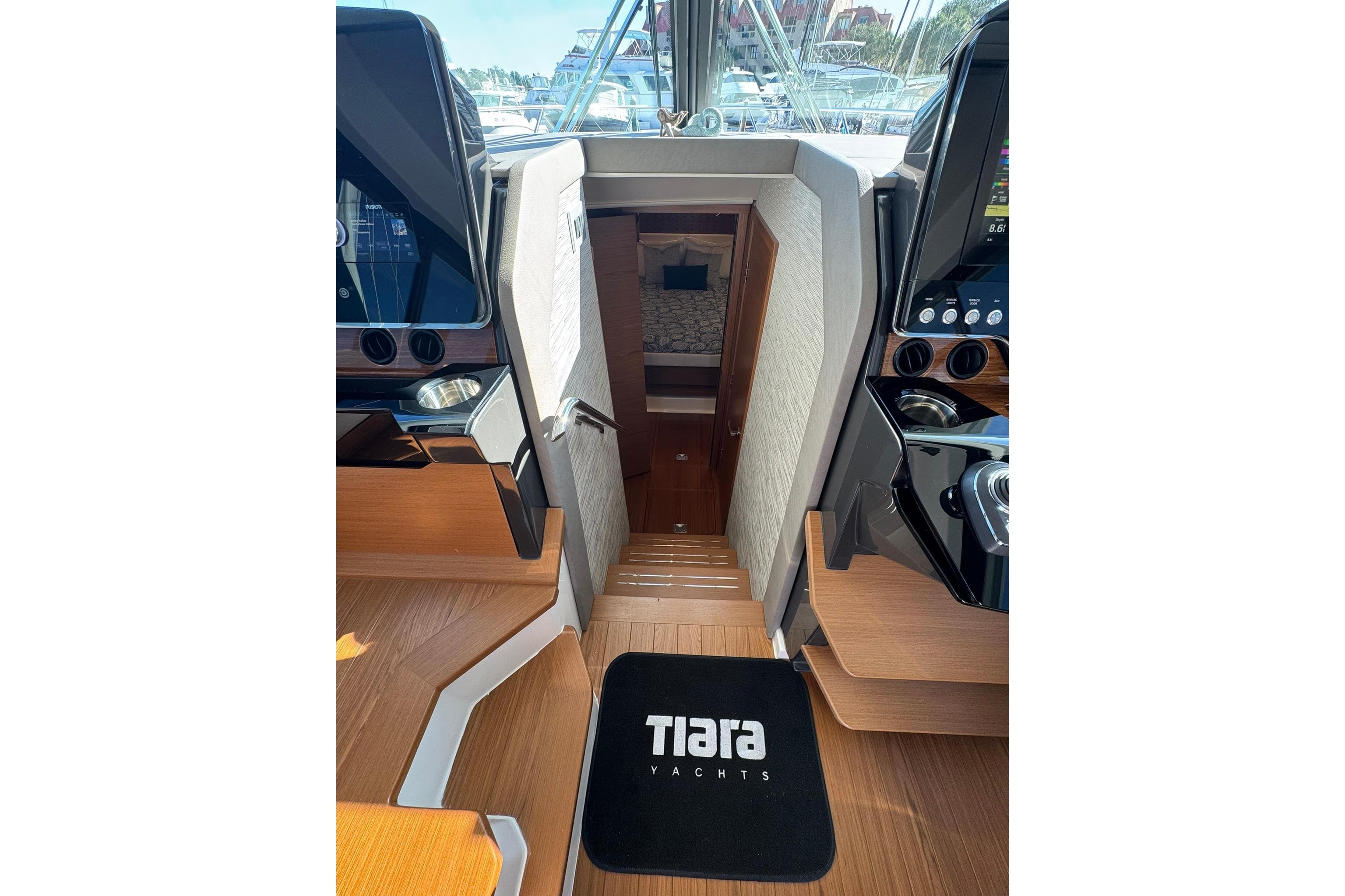 Interior view of 2025 Tiara Yachts 43 LE, featuring sleek wooden stairs and modern design.