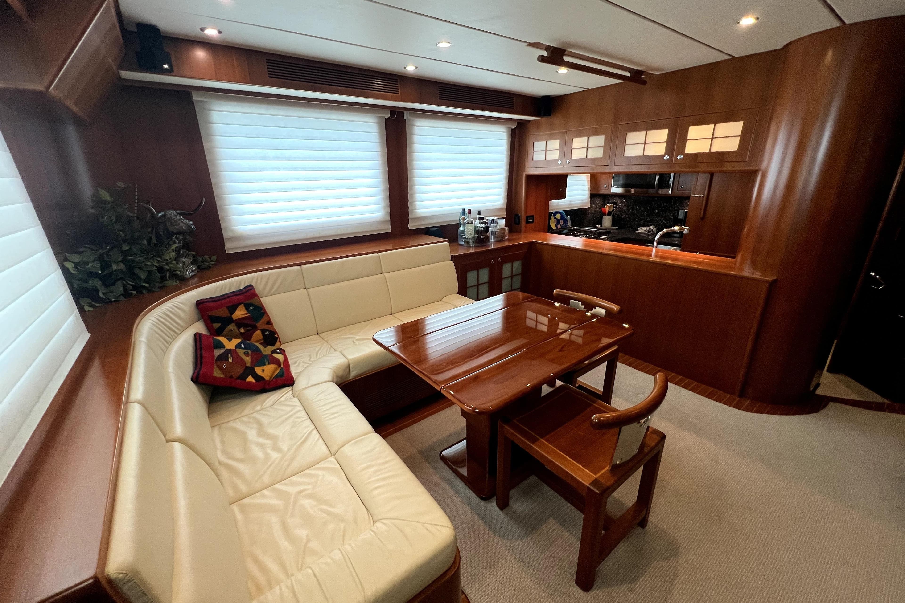 Luxurious interior of a 2011 Nordhavn 60 yacht with elegant wood finishes and cozy seating.