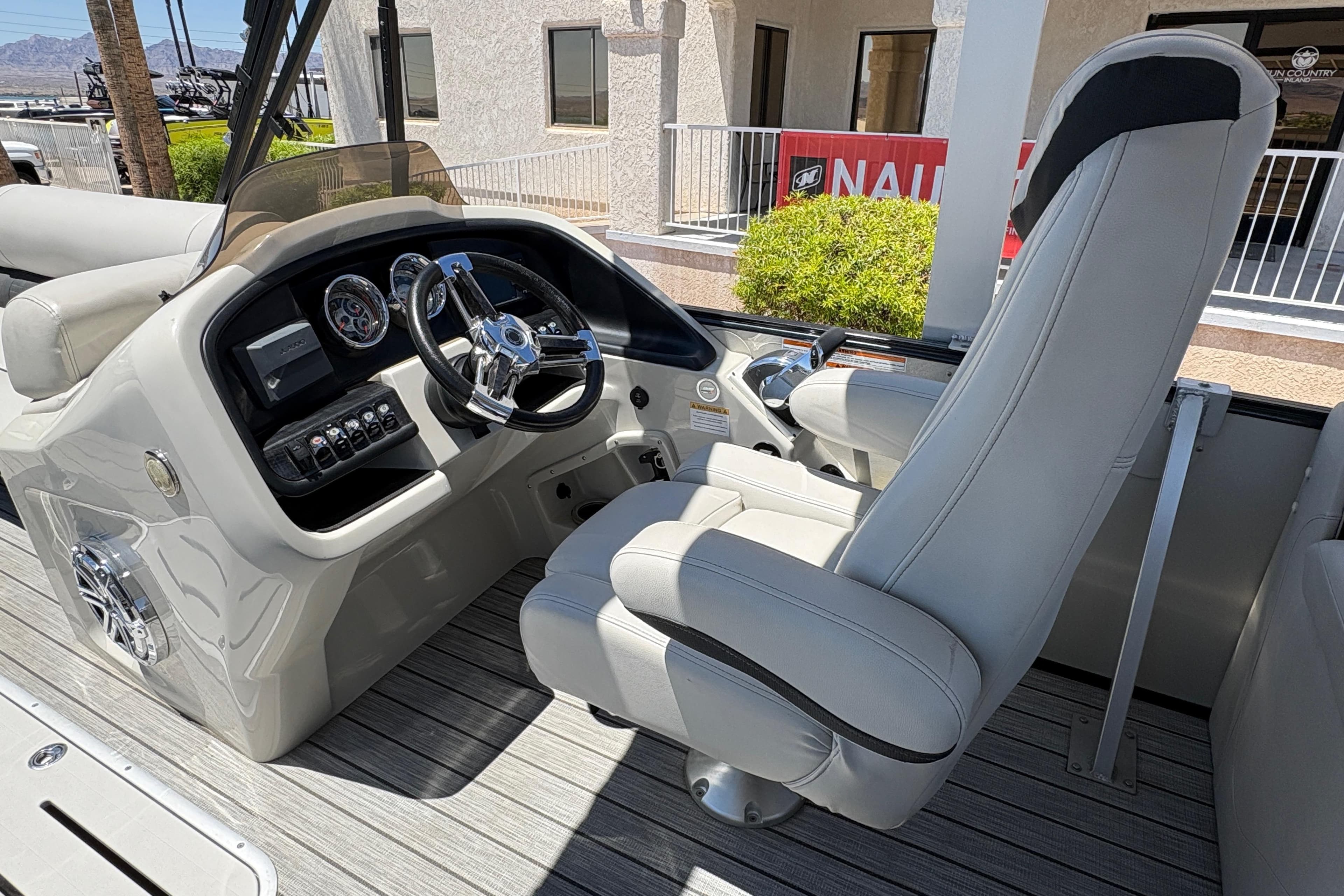 2018 Avalon Catalina Platinum Entertainer Funship interior with steering console and captain's chair.