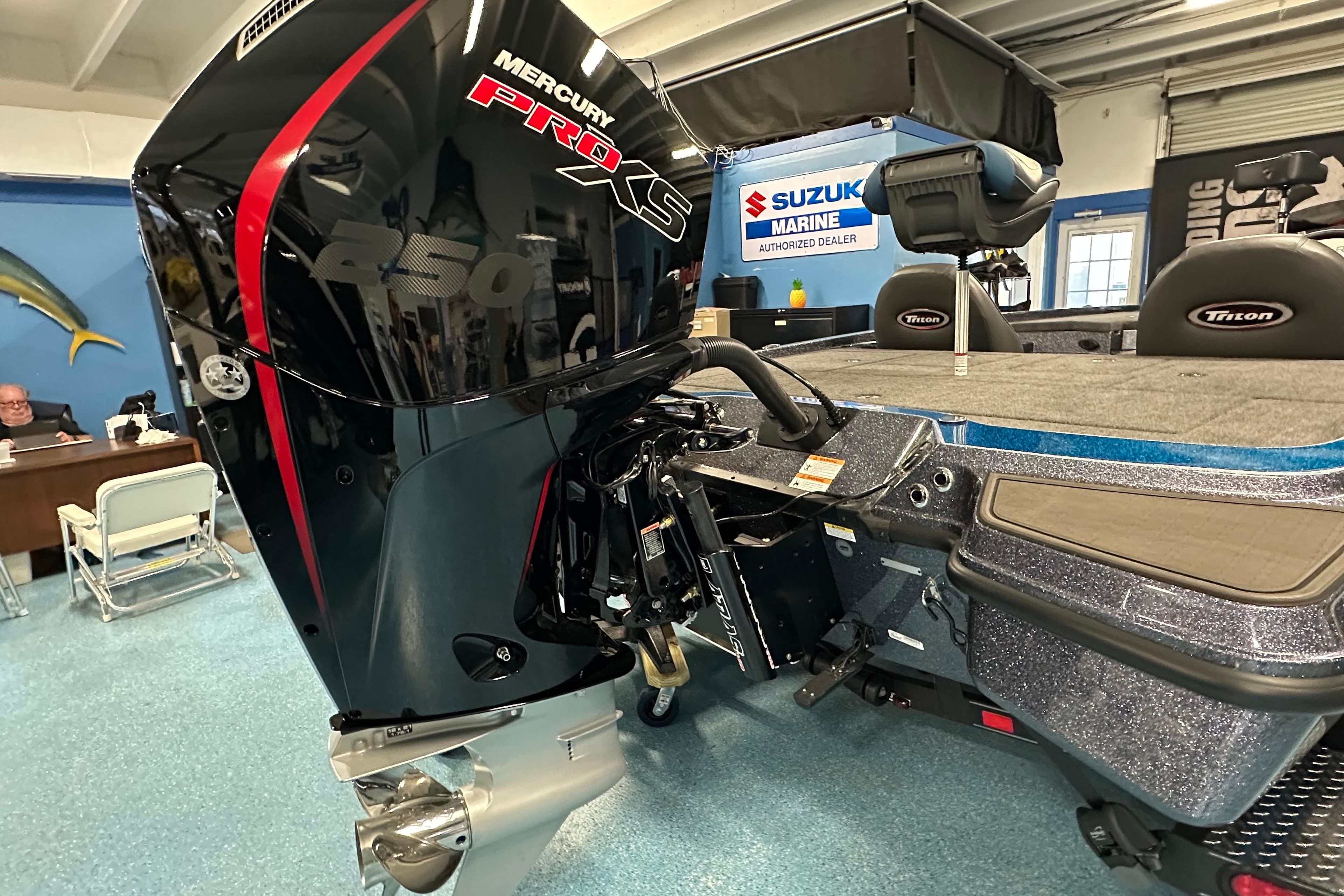 2026 Triton 20XP boat with Mercury Pro XS 250 engine in showroom.