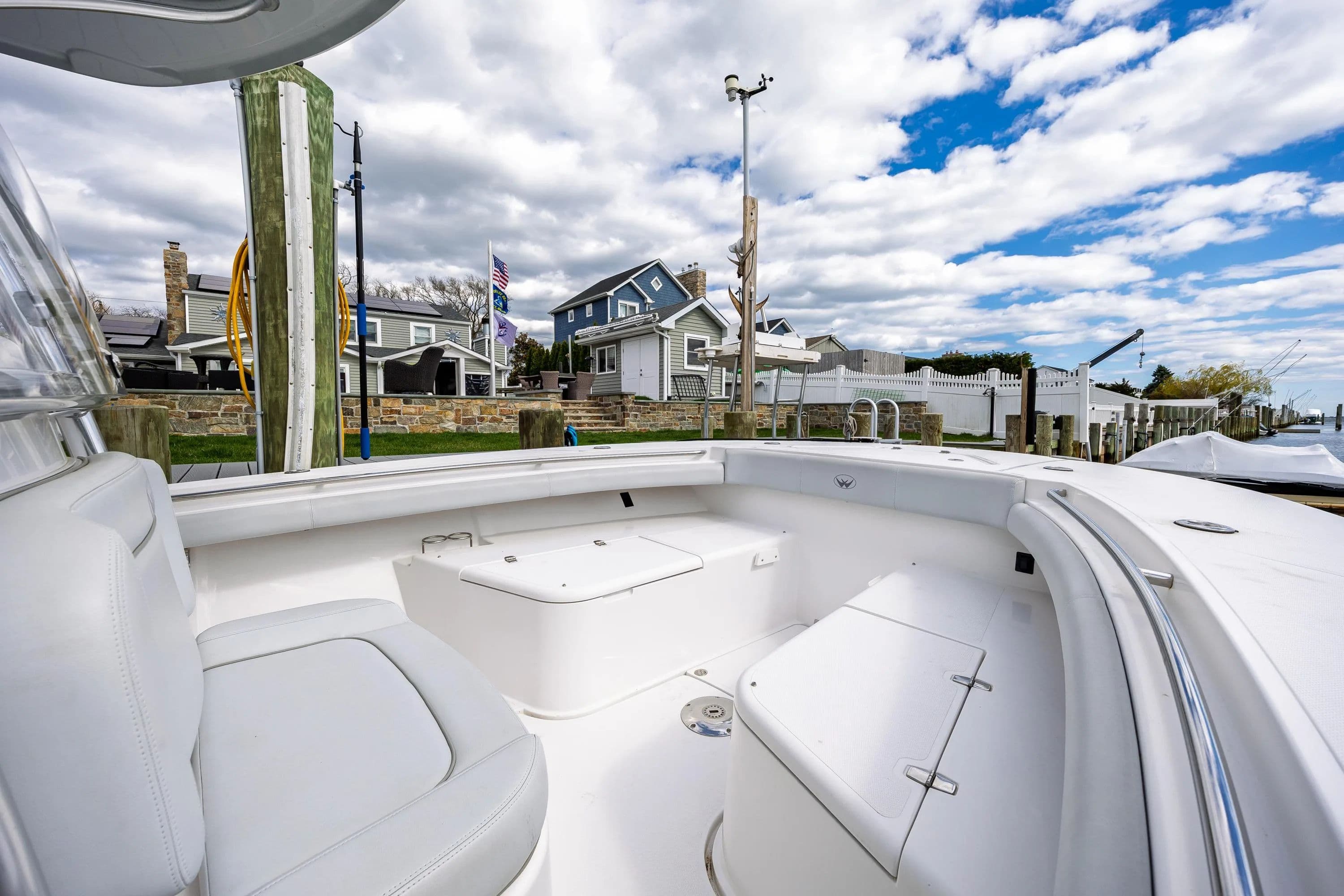 2018 Southport 29 FE boat docked with houses in the background.
