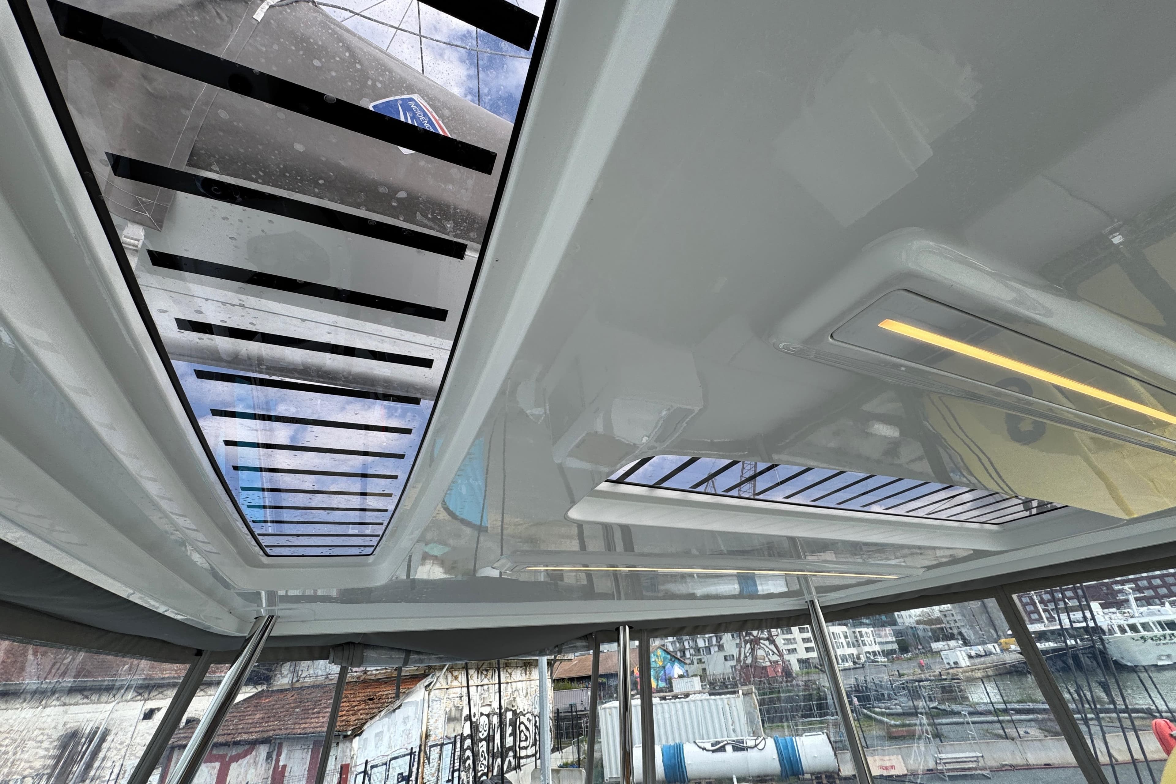 Interior view of 2026 Lagoon 55 yacht with skylight and modern design.