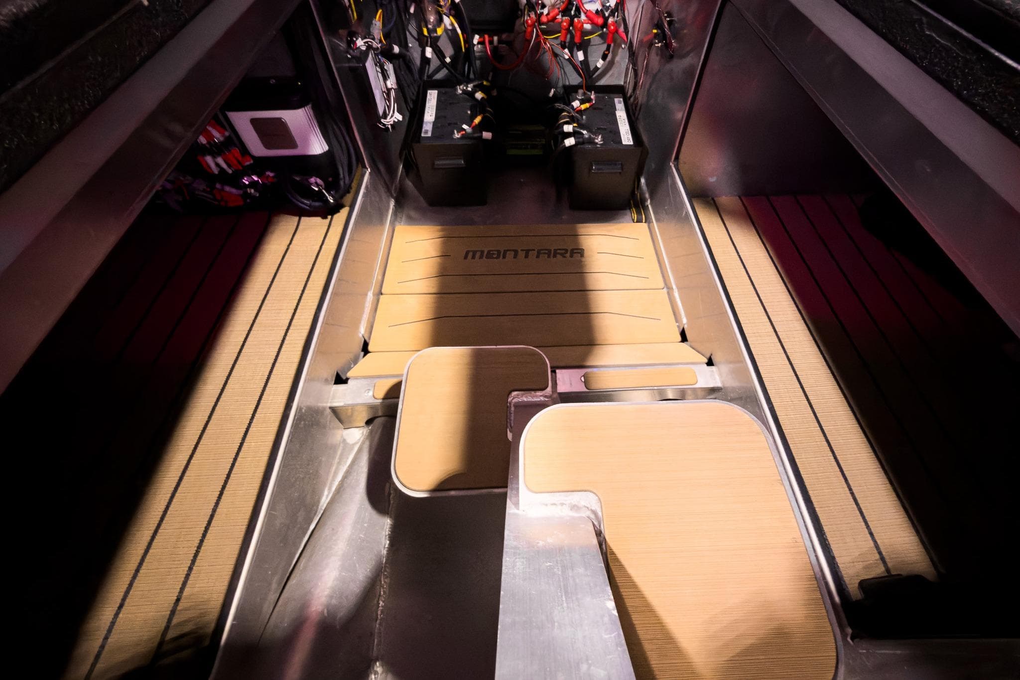 Interior view of 2026 Montara Surf Boss EVO SL 23' boat engine compartment.