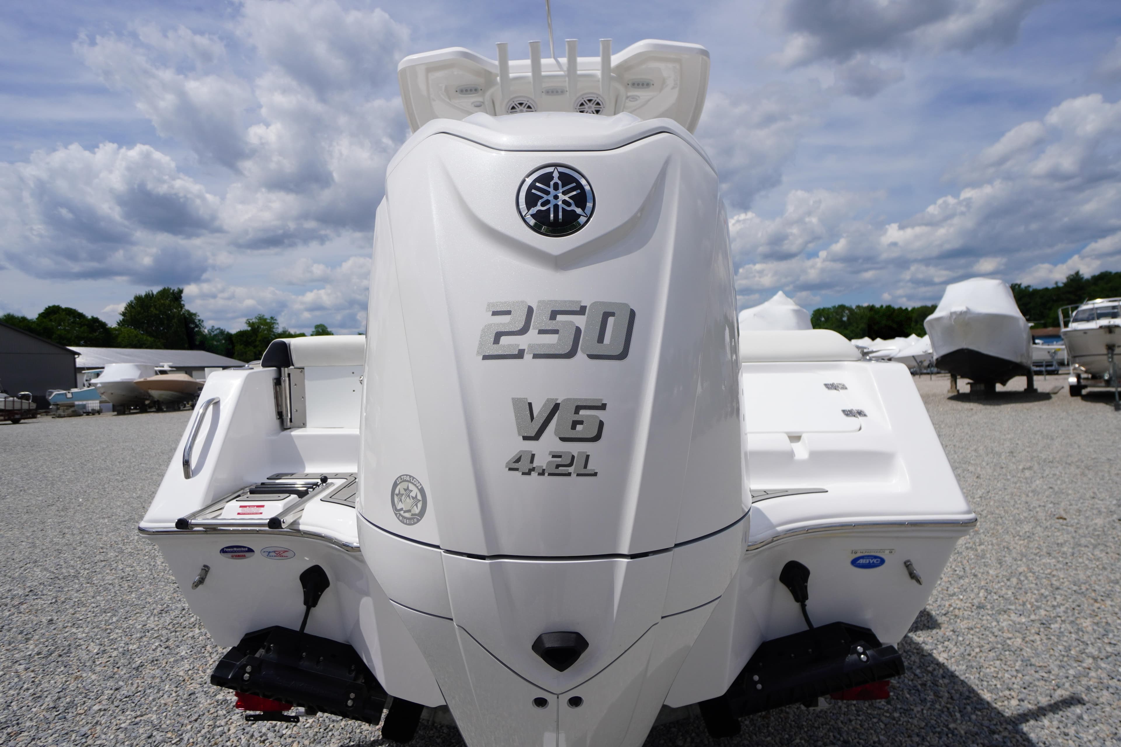 2026 Tidewater 232 SS boat with 250 V6 4.2L engine, parked outdoors.