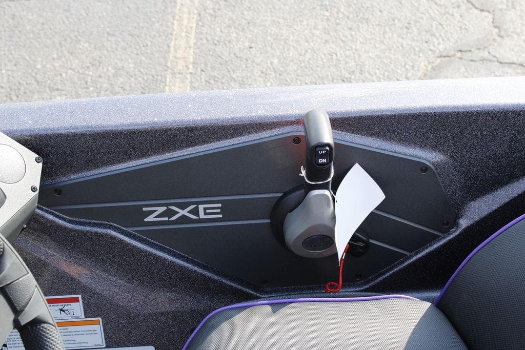 Control panel of a 2026 Skeeter ZXE21 boat with throttle lever.