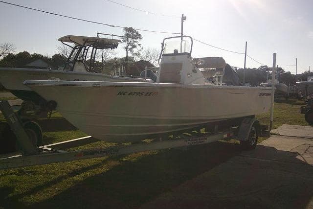 2017 Sportsman Masters 207 Bay Boat on trailer, parked outdoors in sunlight.