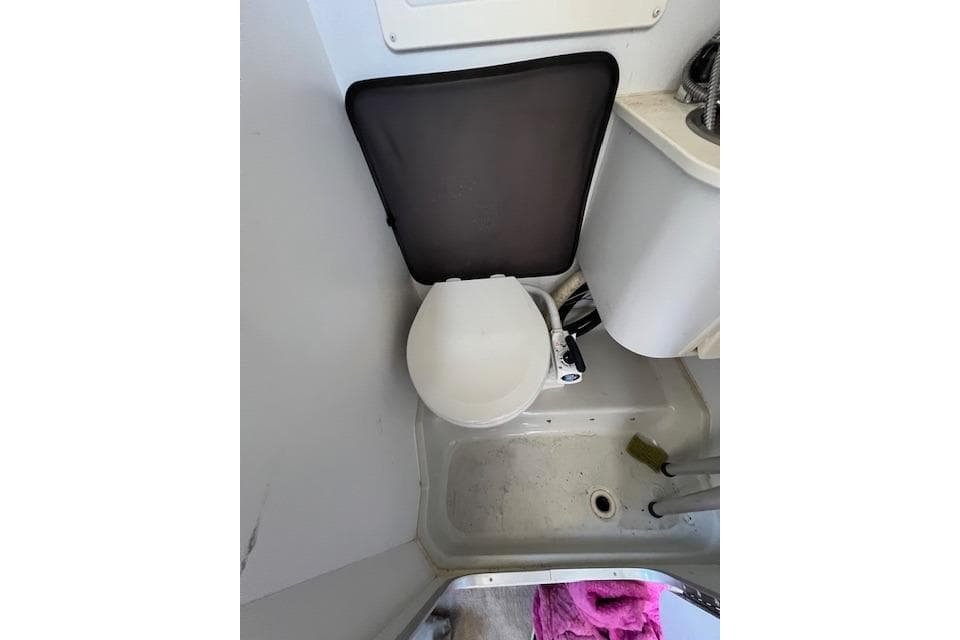 1997 Crownline 250 CR boat bathroom with toilet and sink.