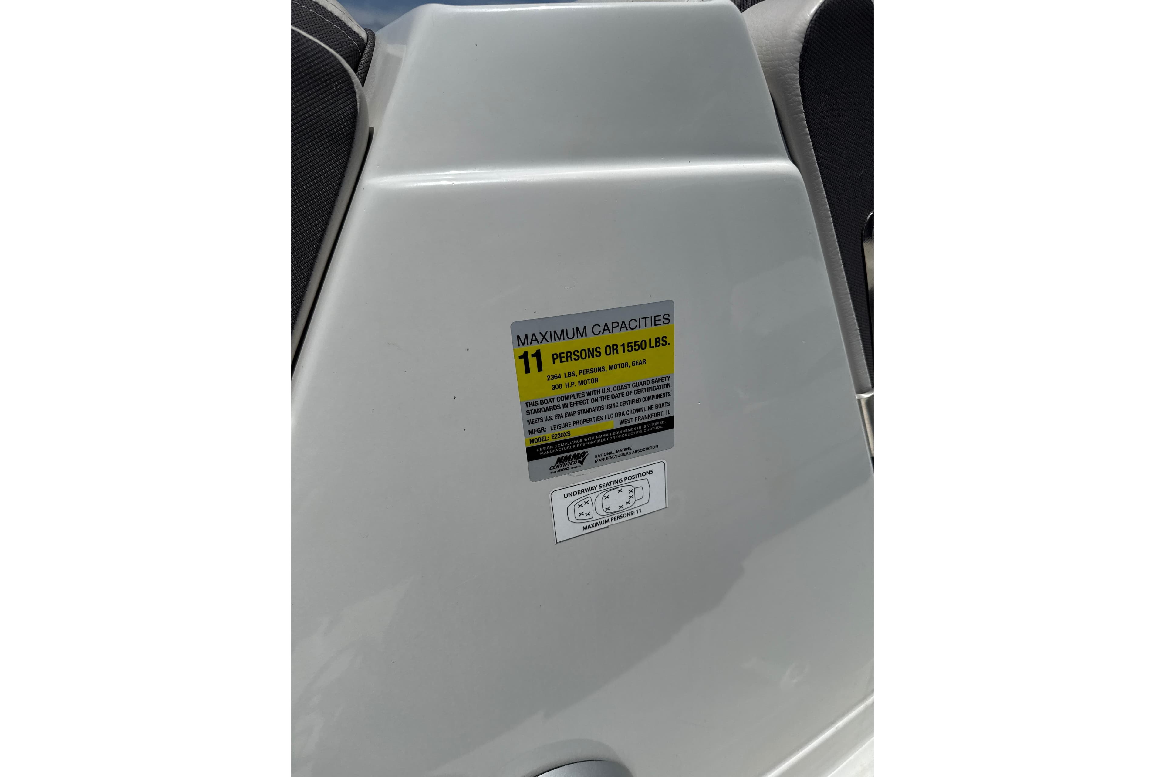 2024 Crownline Eclipse E230 XS capacity label, maximum 11 persons or 1550 lbs.