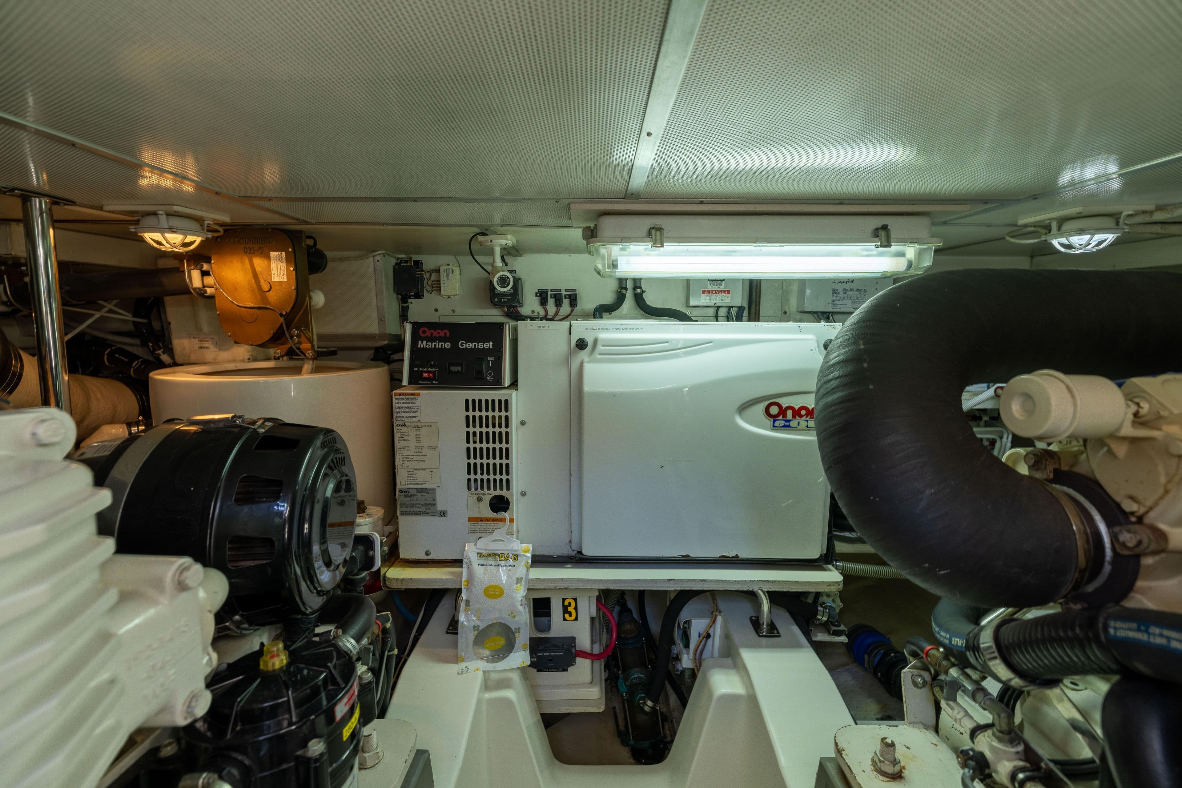 Engine room of 2008 Grand Banks 45 Eastbay SX with Onan Marine Genset.