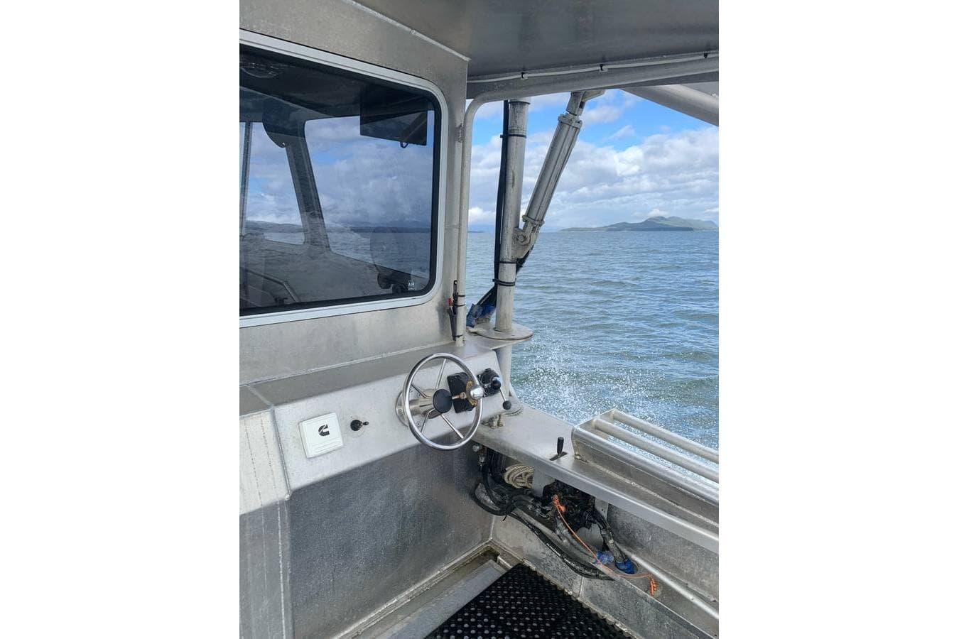 Interior view of a 2021 Custom Aluminum Crabber boat on the water.
