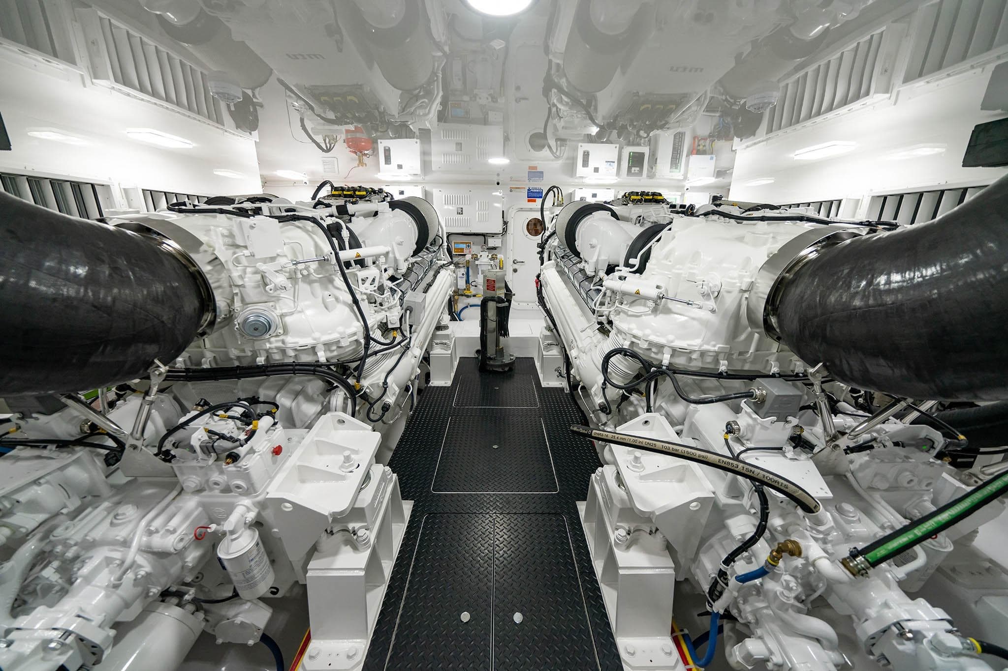Engine room of 2026 Viking 74 Convertible yacht, showcasing powerful dual engines.
