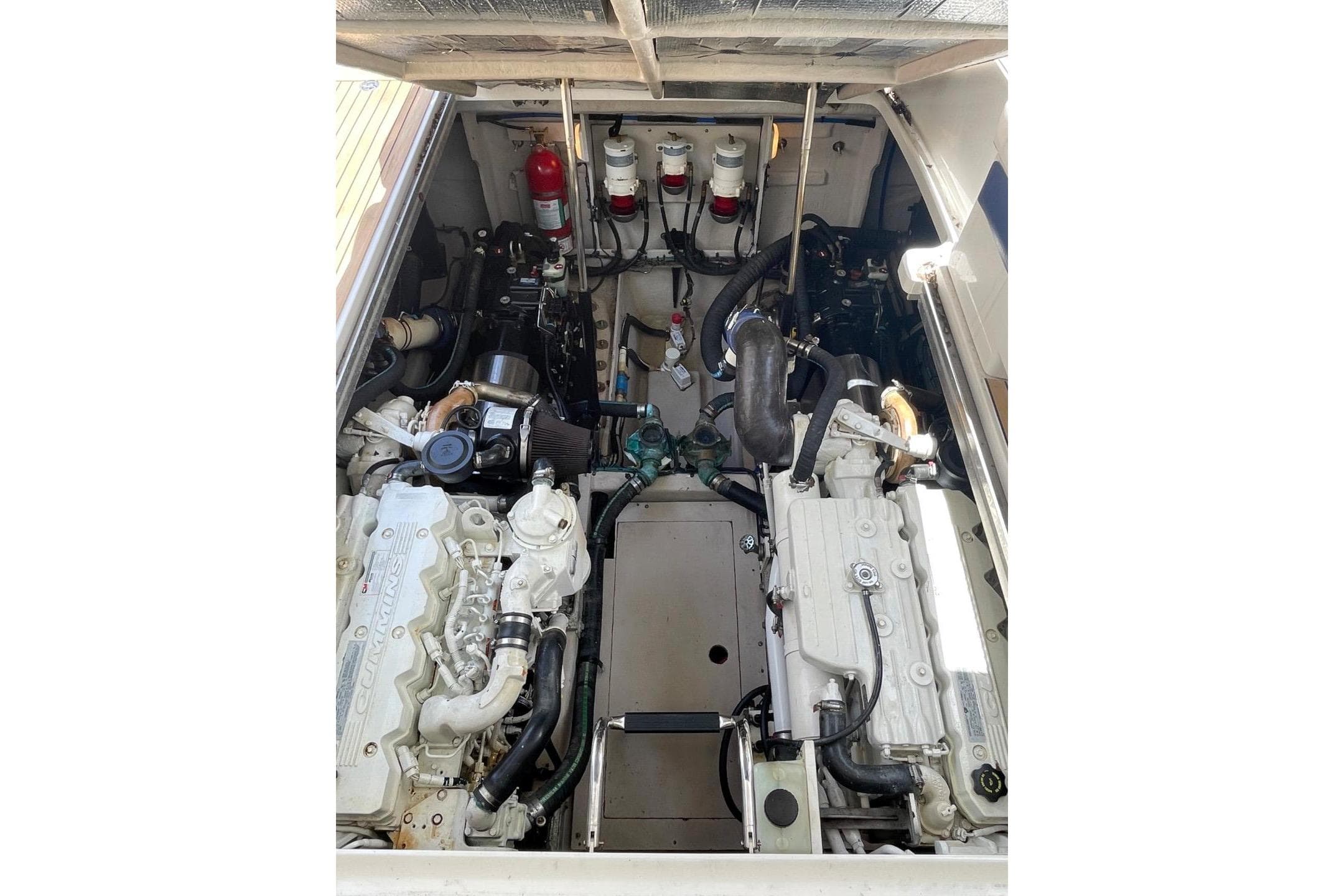 Engine compartment of 2010 Sea Ray 450 Sundancer, featuring dual Cummins engines.