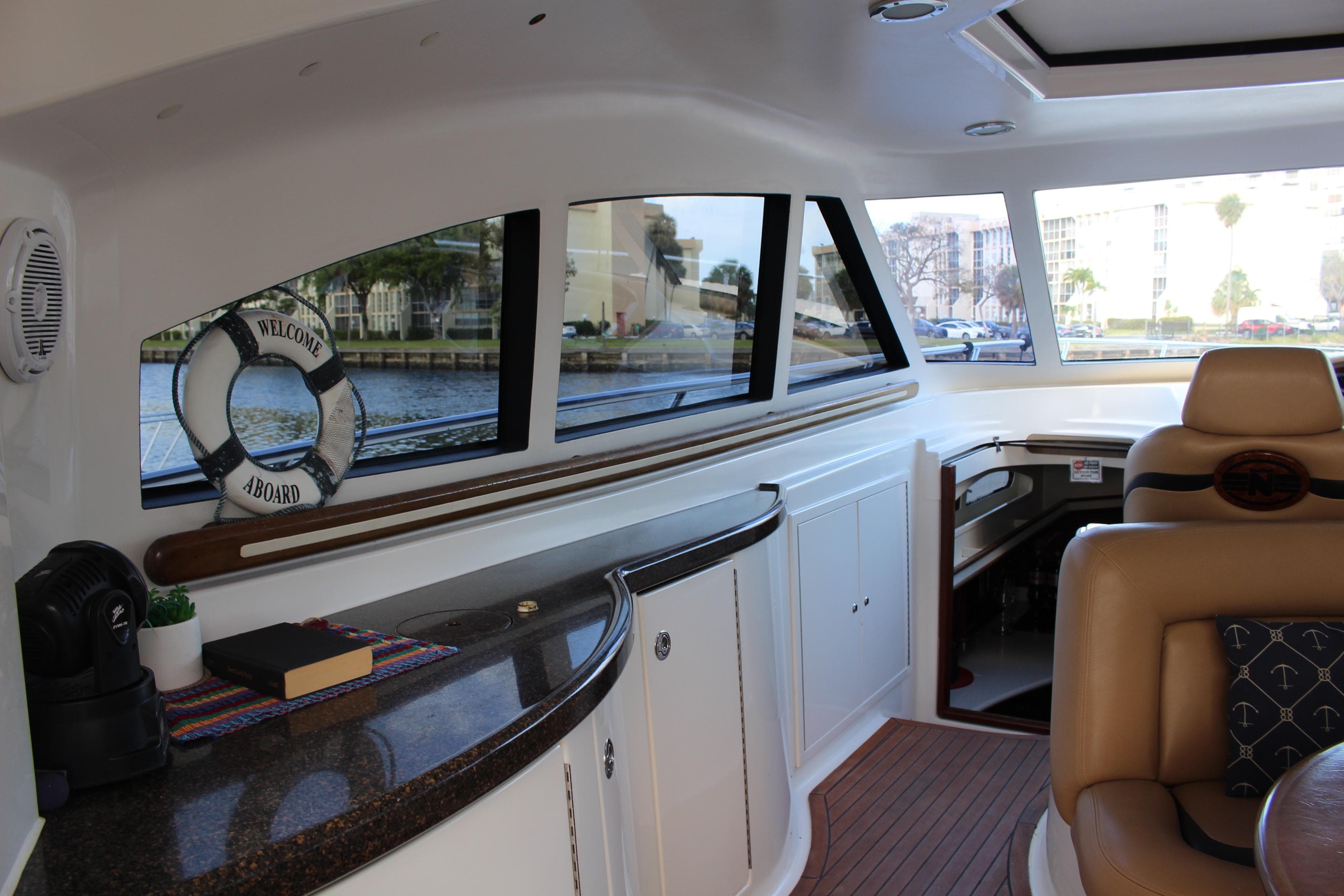 Interior of 2006 Neptunus 55 Cabrio yacht with luxurious seating and sleek design.