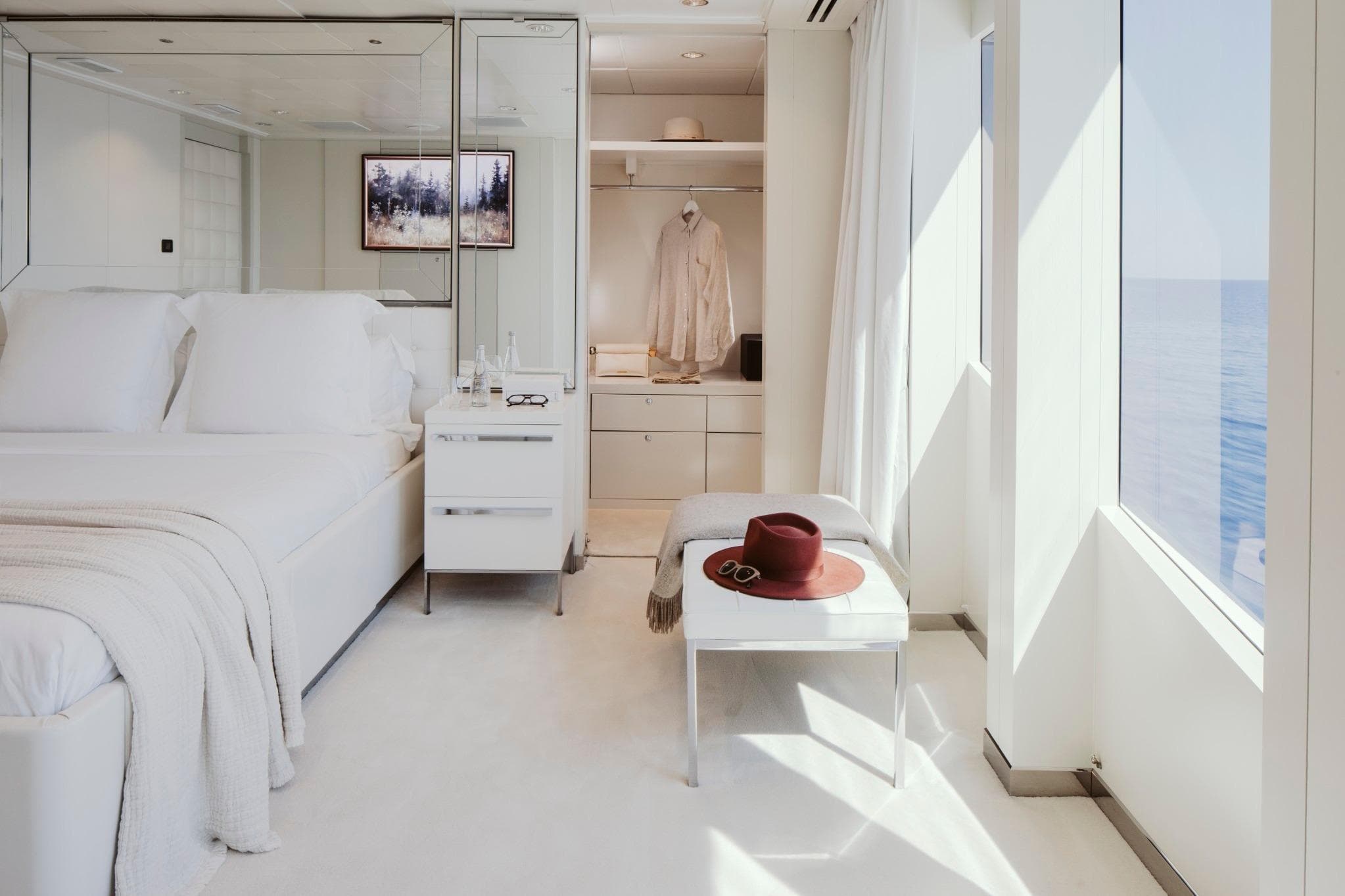 Luxurious yacht bedroom with ocean view, featuring elegant decor and modern furnishings, Austal Displacement 2007.