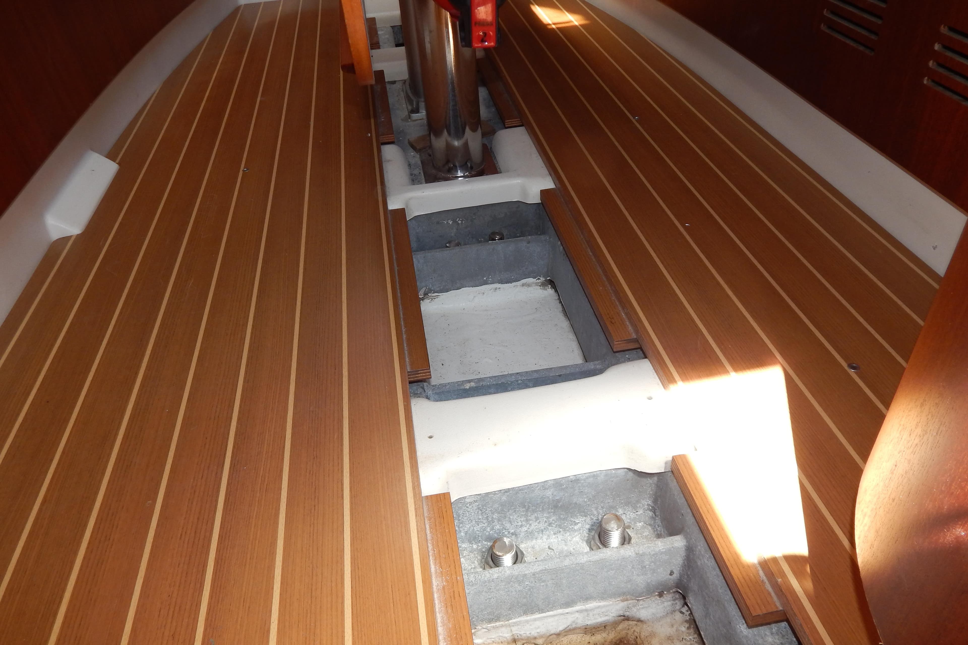 Interior view of 2003 X-Yachts X-362 sailboat with wooden flooring and structural details.