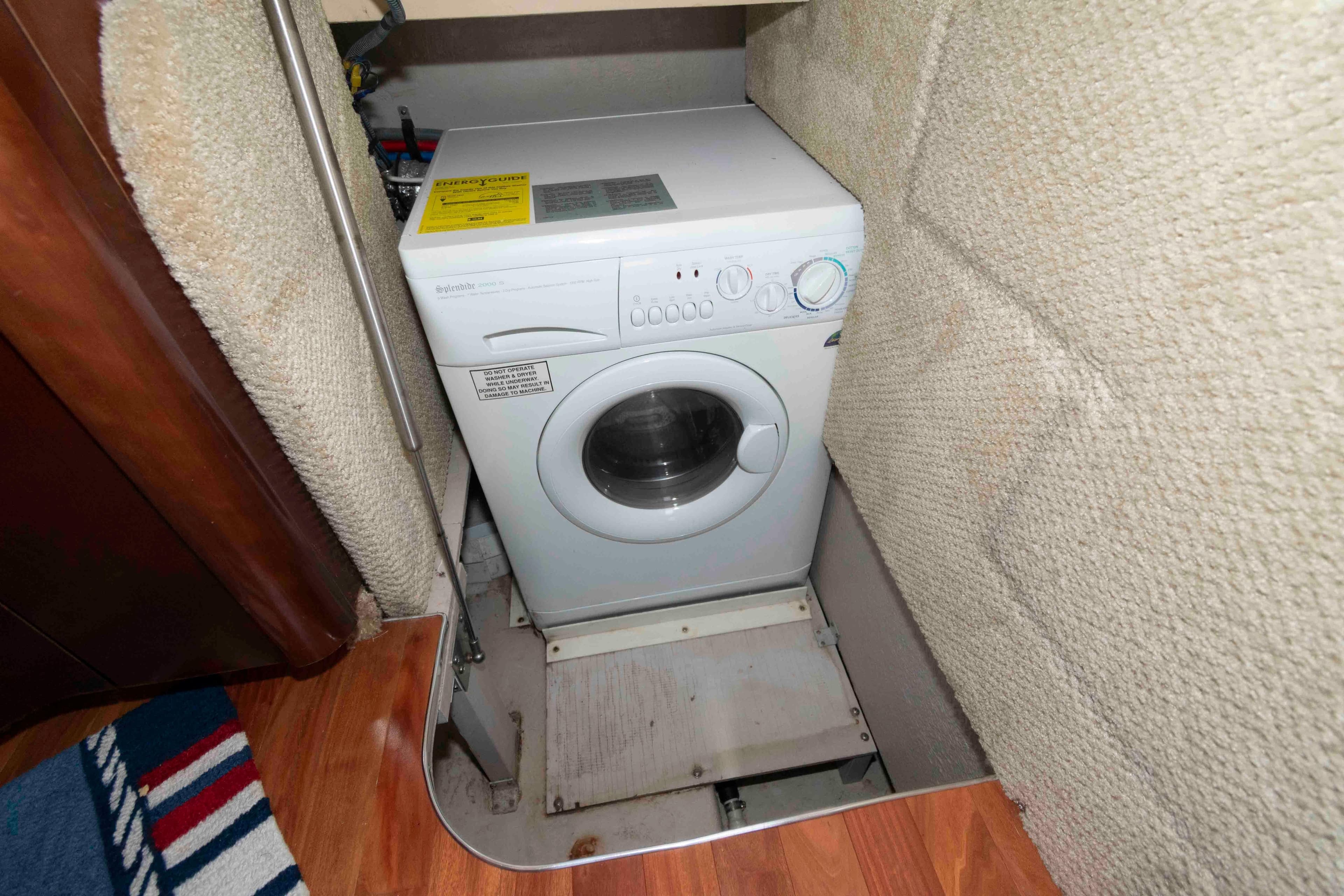 Washing machine in 2005 Sea Ray 420 Sedan Bridge yacht interior.