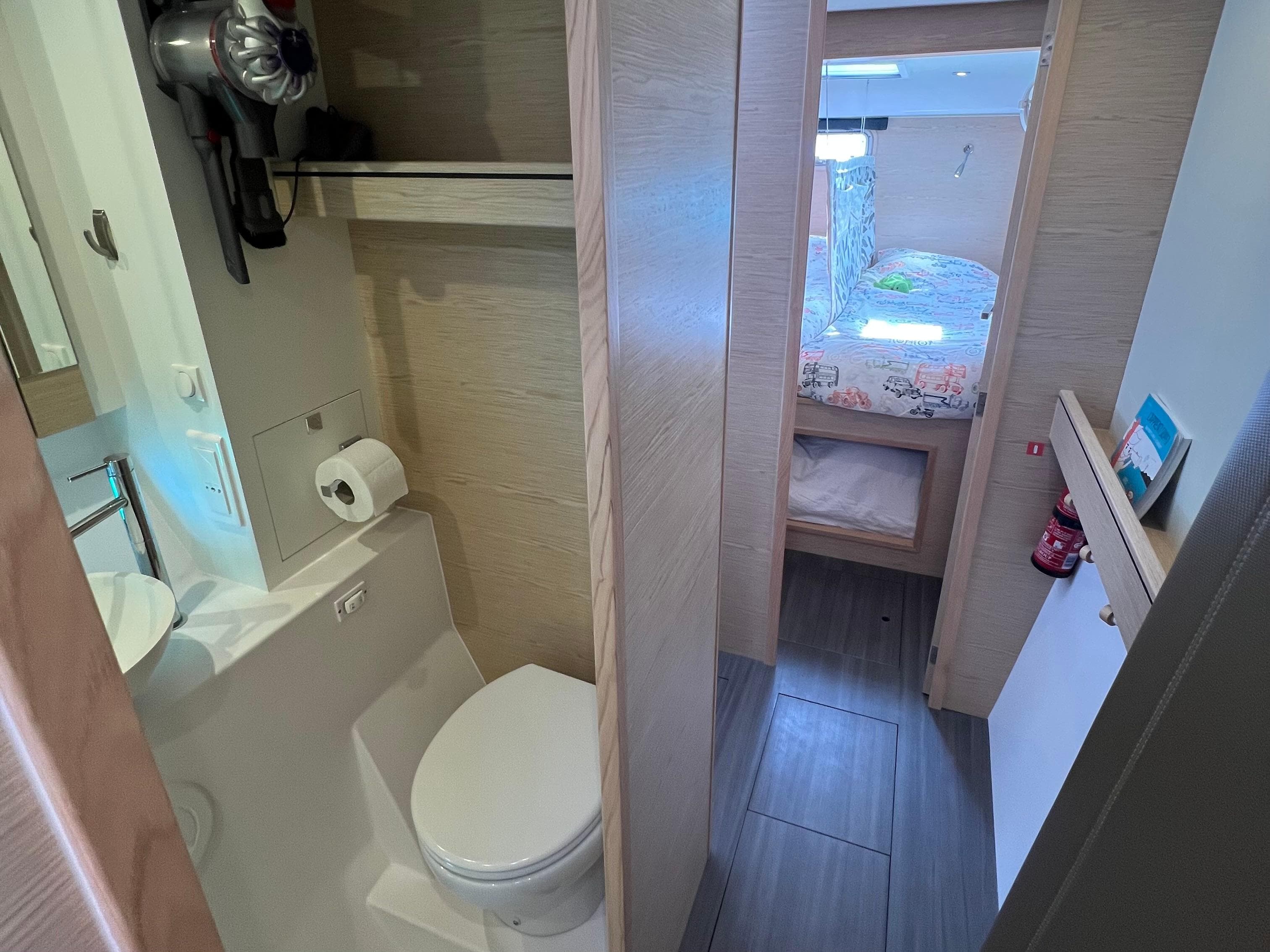 2024 Outremer 45 yacht interior with bathroom and cozy cabin view.