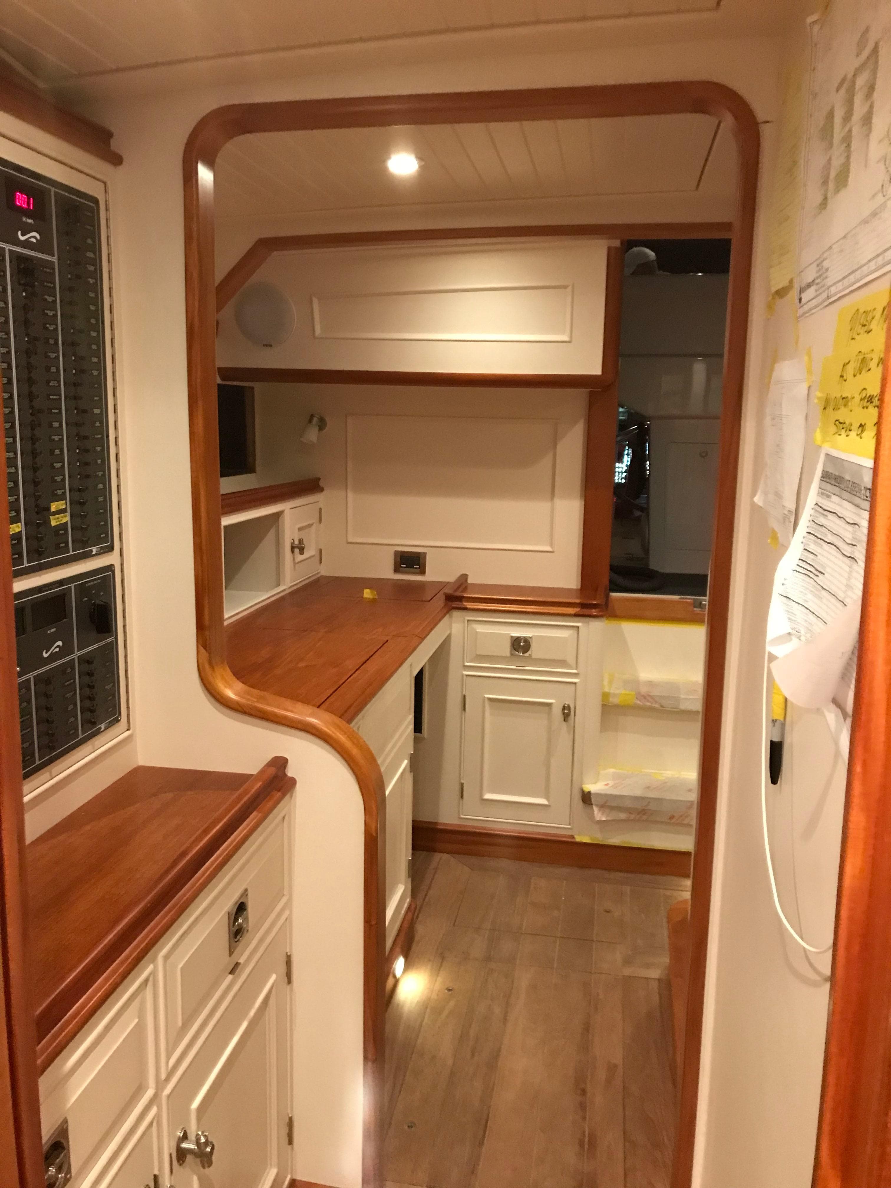 2025 Surfari 50 yacht interior with wooden cabinetry and modern design.
