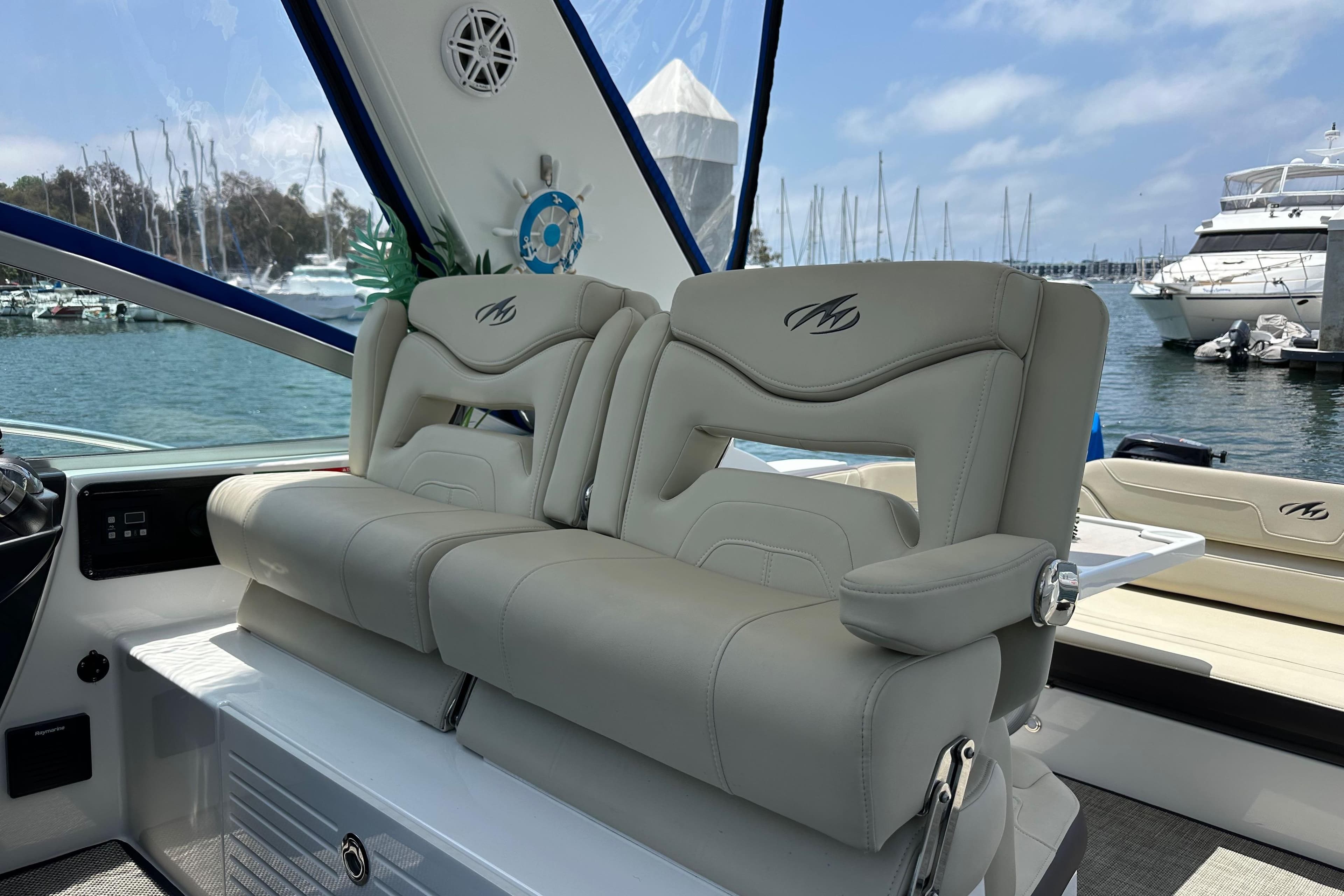 Luxury seating on a 2020 Monterey 355 Sport Yacht, docked at a marina.