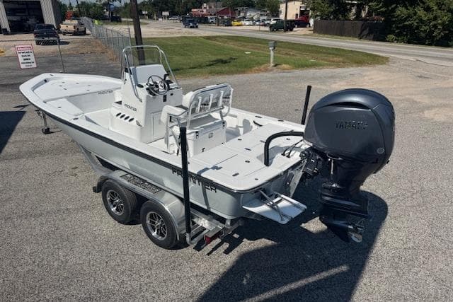2026 Frontier 2104 boat on trailer with Yamaha outboard motor, parked outdoors.