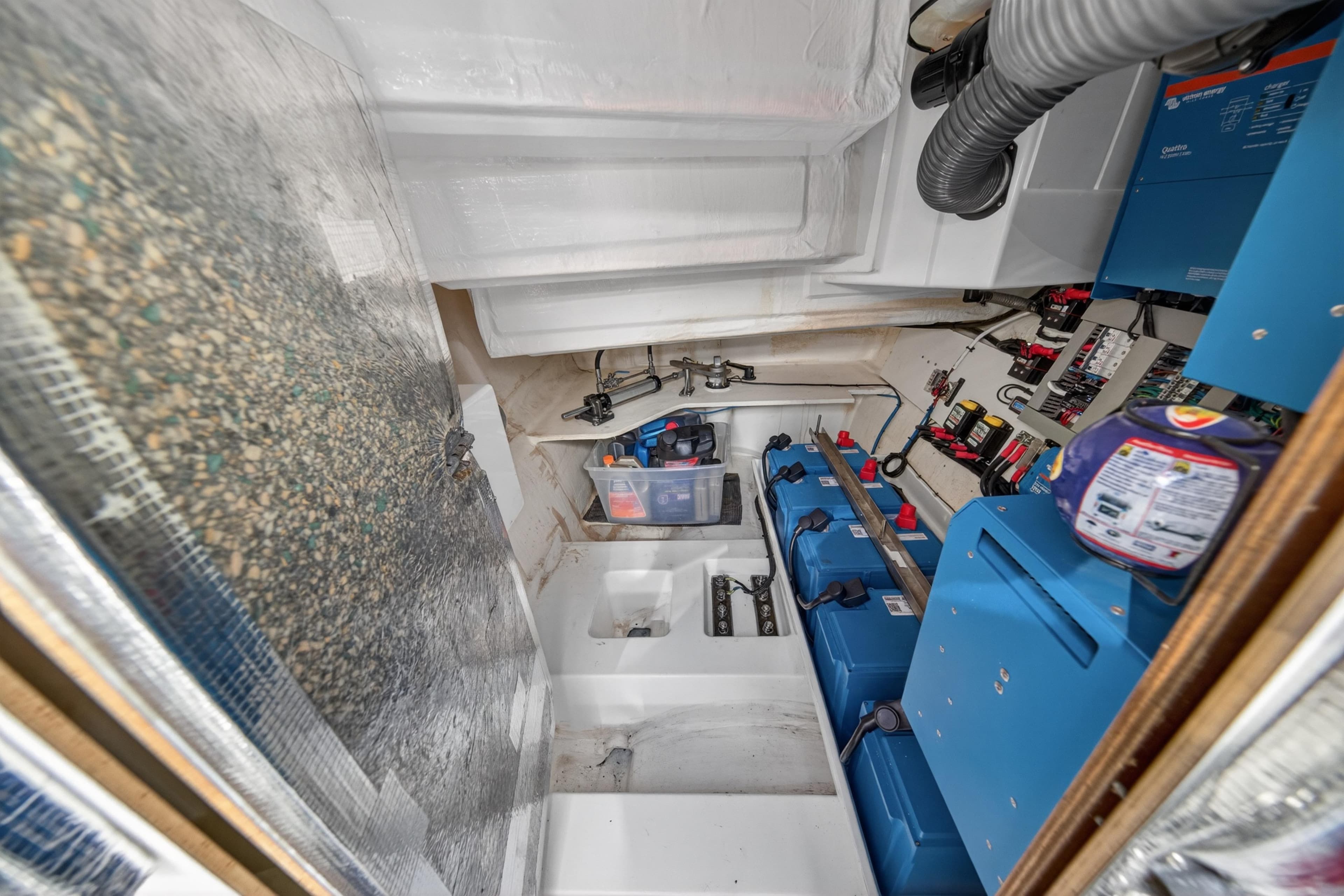 Engine room of 2022 Leopard 53 Powercat with batteries and electrical systems.