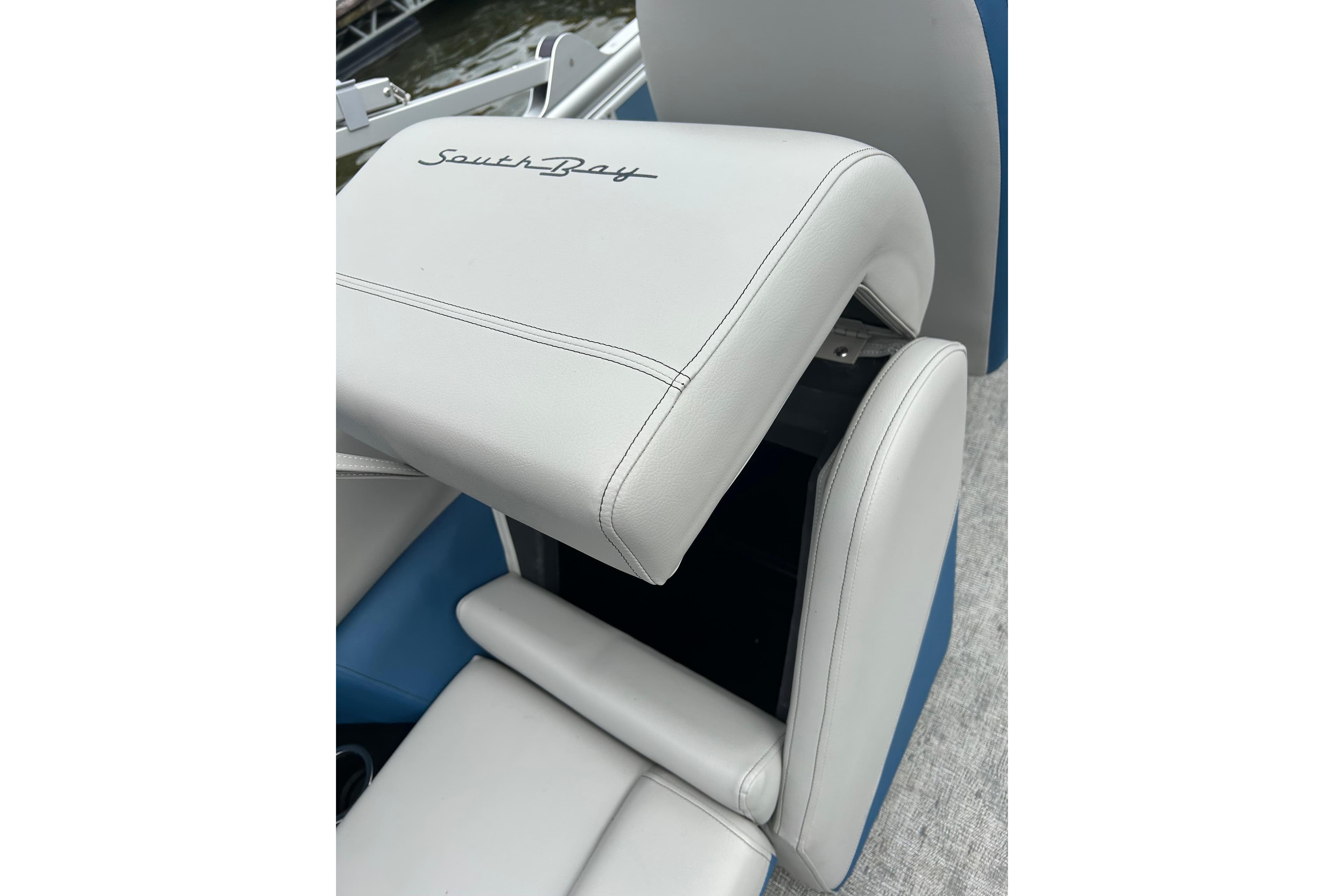 White leather seat with "SouthBay" logo on a 2025 Southbay 224RSLE25 boat.