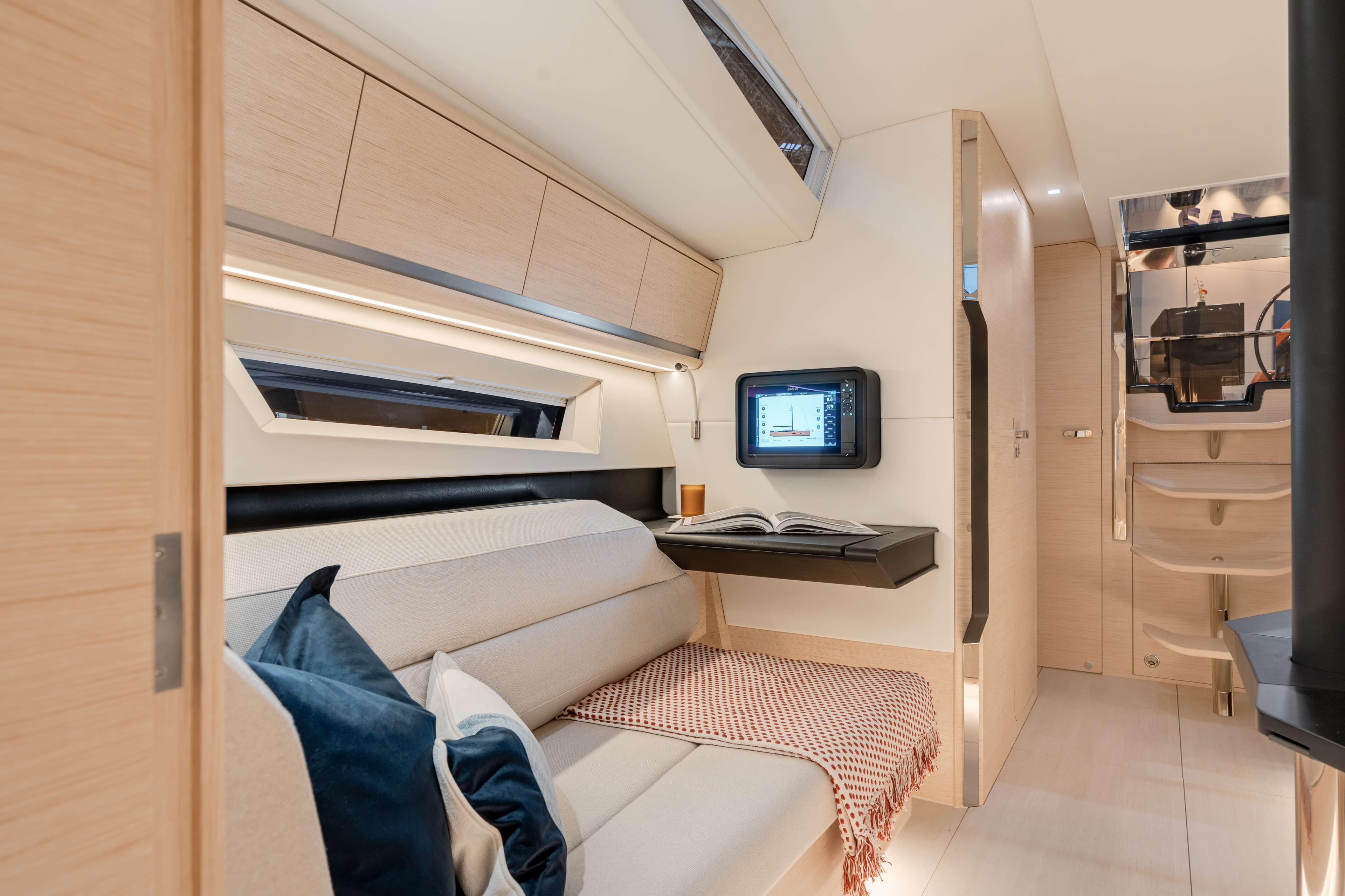 Luxurious interior of 2027 Saffier SL 46 MED yacht with modern seating and digital display.