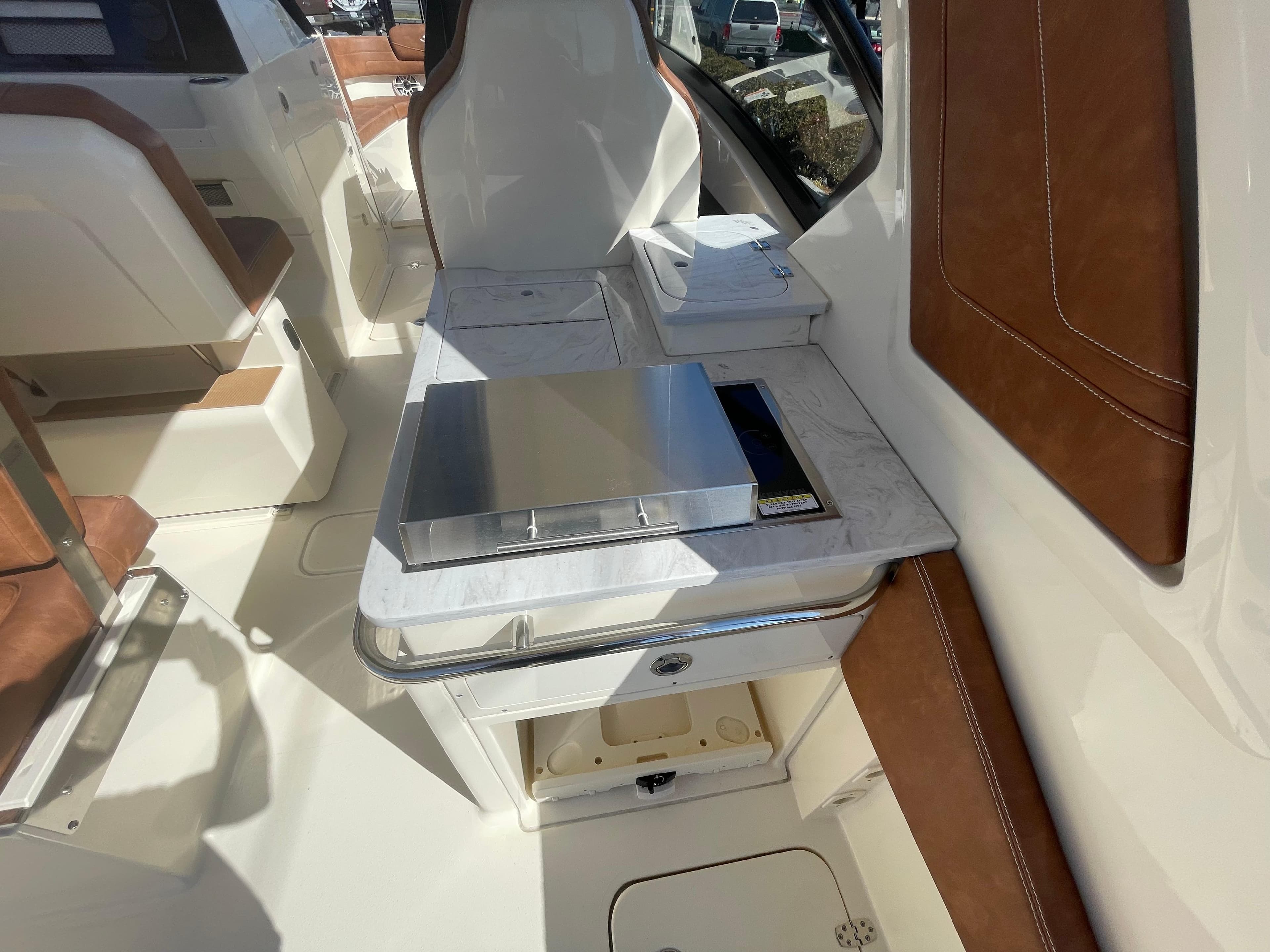 2024 Scout 277 Dorado boat interior with seating and storage compartments.