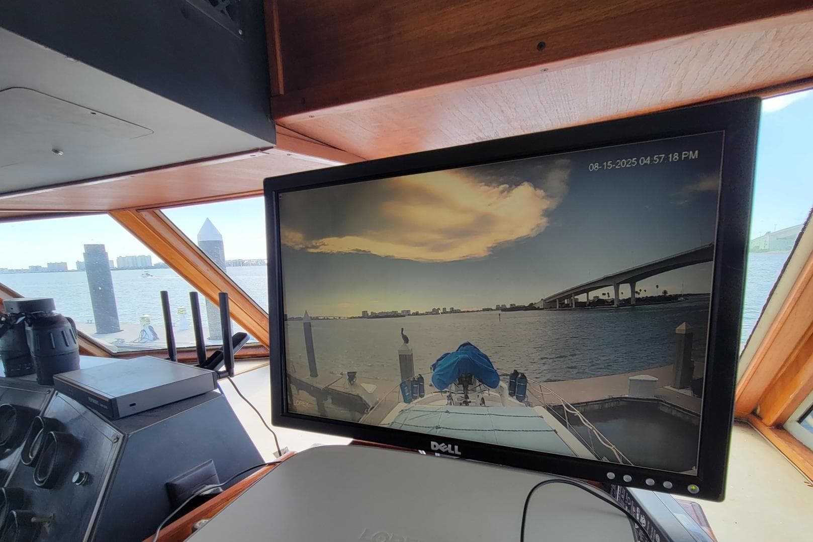 Interior of 1985 Chris-Craft 500 Constellation with monitor displaying marina view.