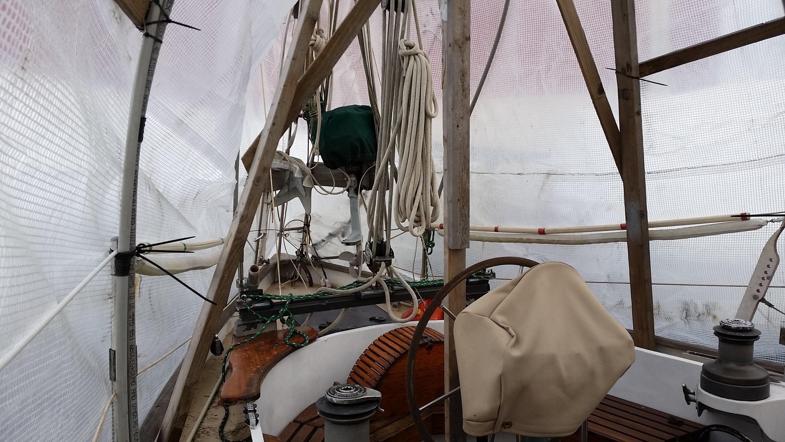 Covered deck of 1960 Frans Maas-LeFevre One Off Custom 47 sailboat, showing rigging and equipment.