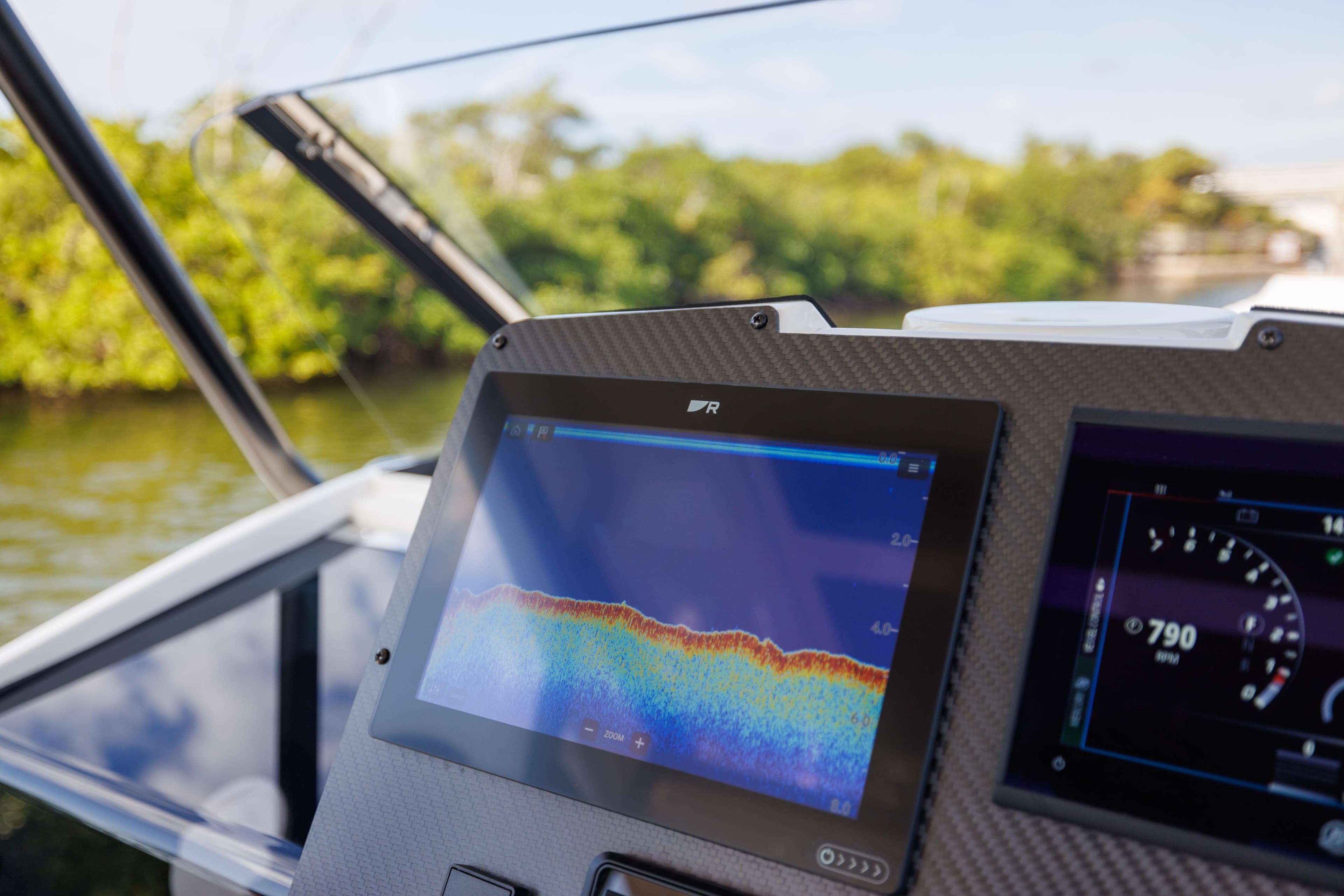 2024 Nuova Jolly Prince 38 dashboard with navigation display, near lush greenery.