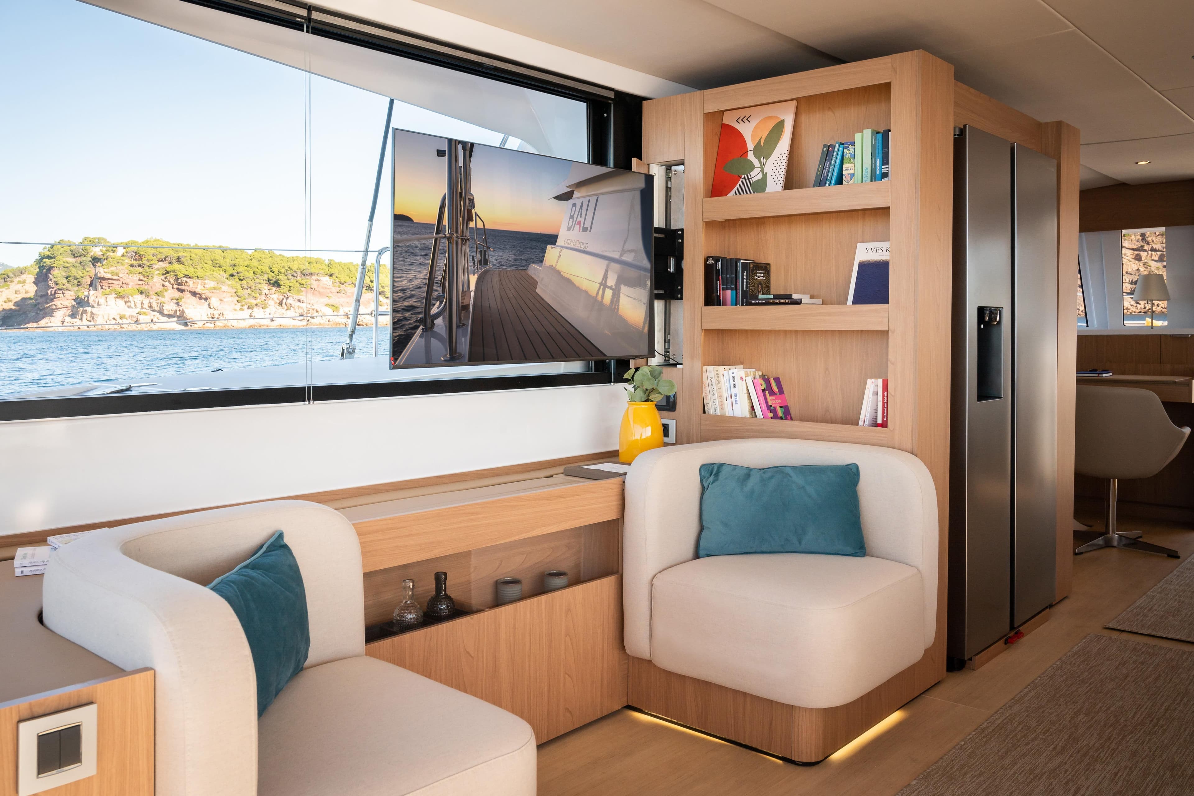 Luxurious interior of 2026 Bali 5.8 yacht with modern furnishings and scenic ocean view.