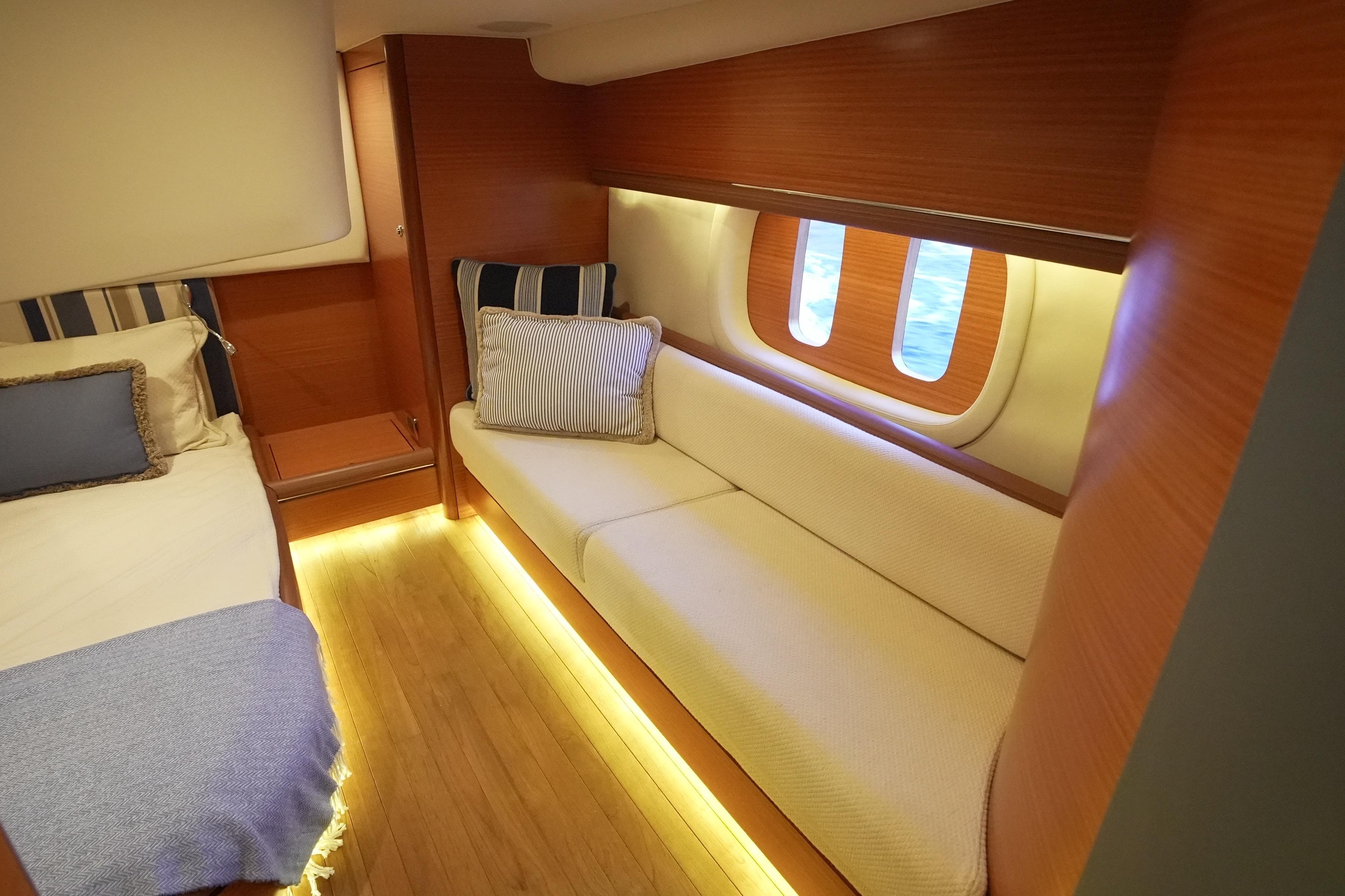 Luxurious interior of 2013 Zeelander Z44 yacht with cozy seating and elegant wood finish.