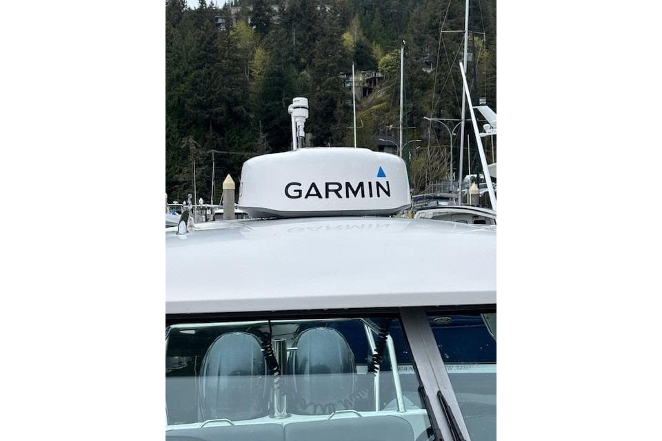2008 Protector Targa 28 boat with Garmin radar, docked in a marina.