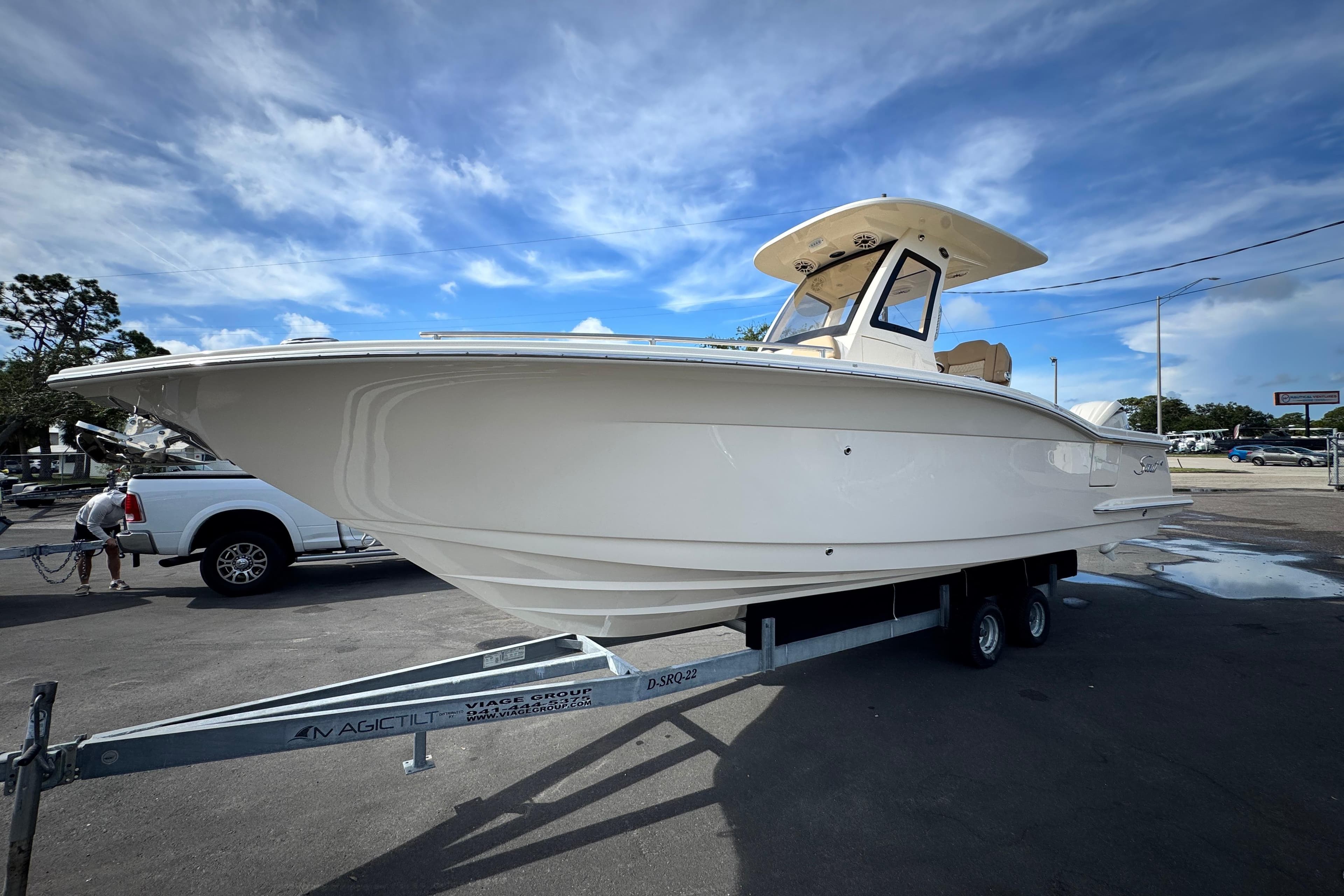 2026 Scout 260 LXF boat on trailer under blue sky.