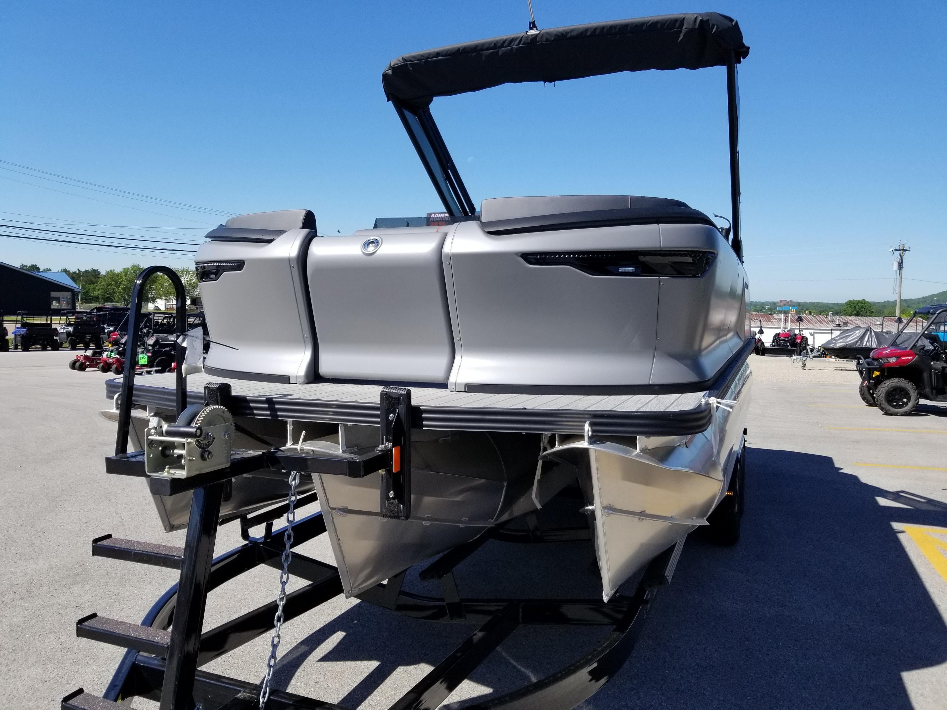 2024 Manitou Explorer 22 Max Bench pontoon boat on trailer.