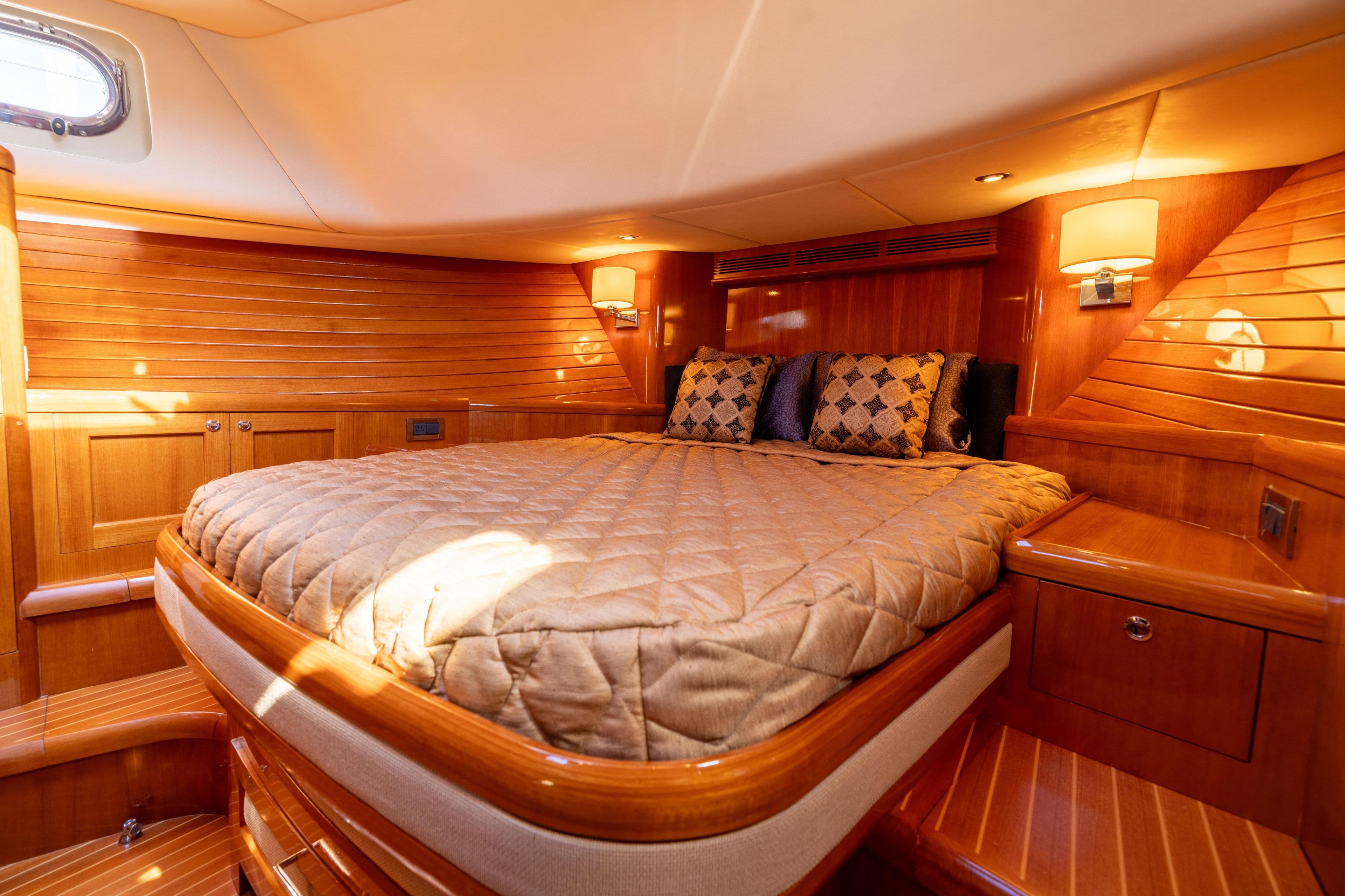Luxurious cabin interior of 2008 Grand Banks 45 Eastbay SX yacht with elegant wood finish.