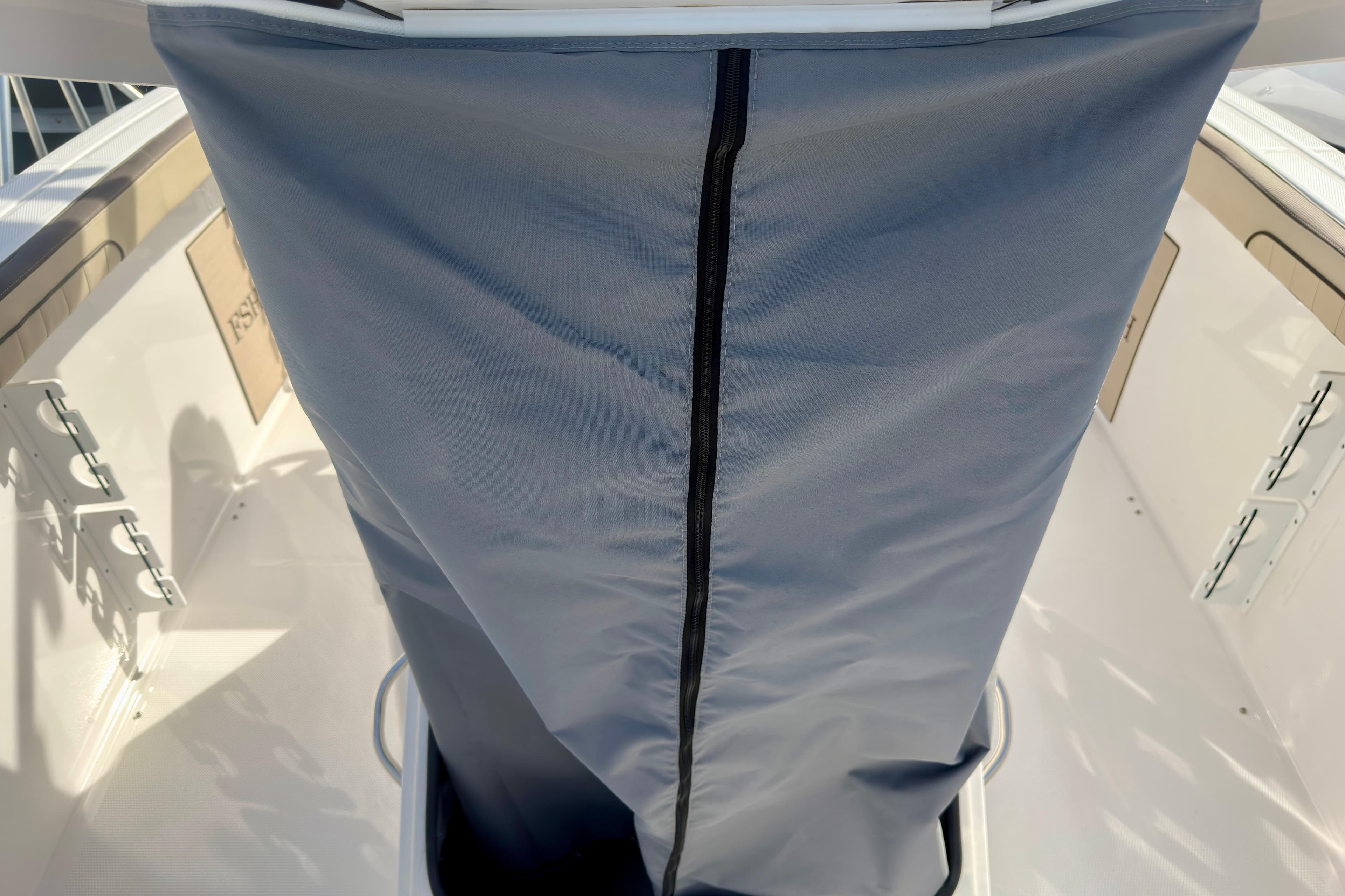 2026 Yamaha Boats 255 FSH Sport H interior with protective cover and sleek design.
