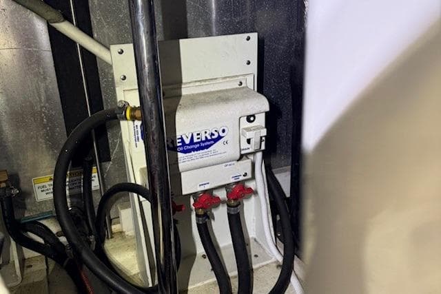 Engine room of 2006 Carver 466 Motor Yacht with Reverso oil change system.