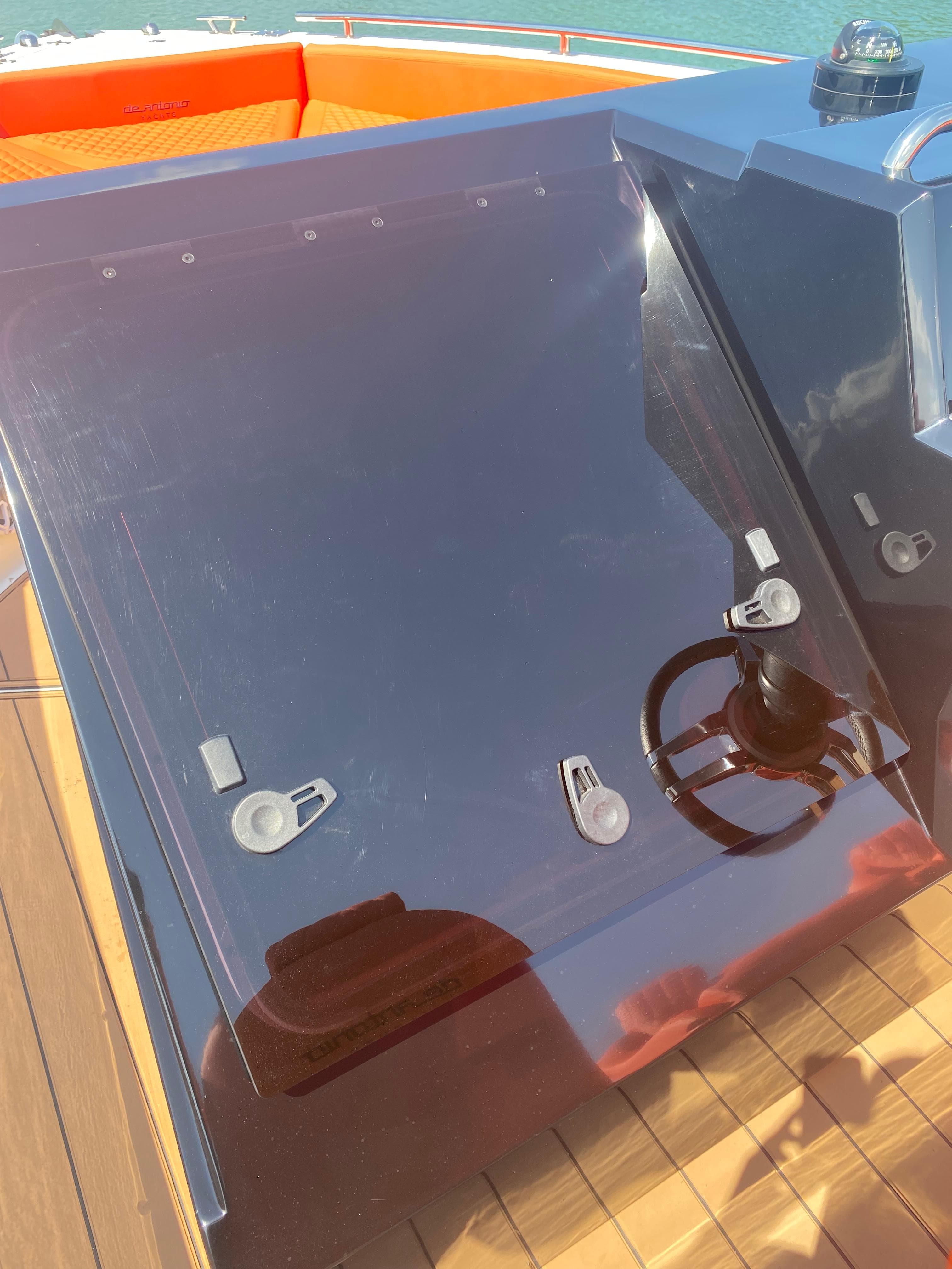 2020 De Antonio Yachts D 28 helm station with modern controls and sleek design.