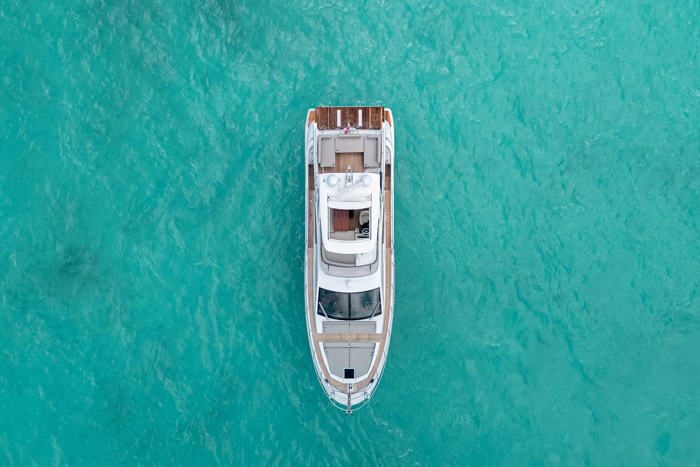Aerial view of 2016 Azimut 50 yacht on turquoise water.