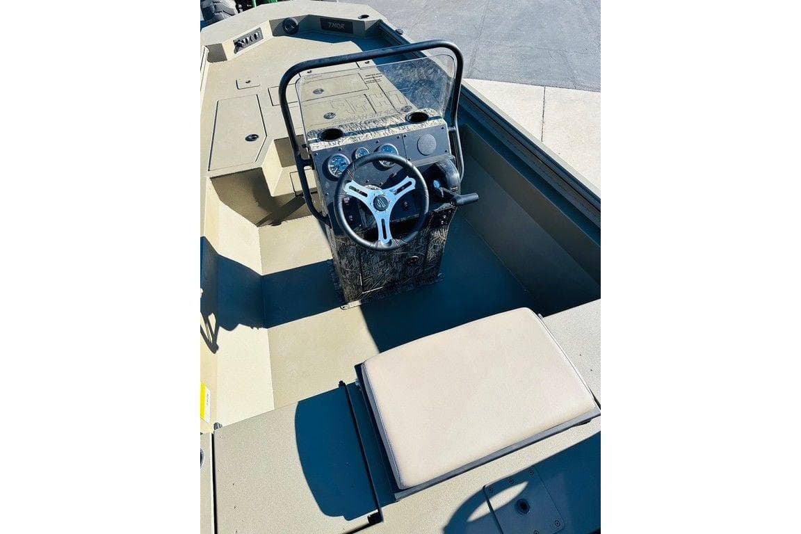 2026 Thor 1900 boat interior with steering wheel and seating.