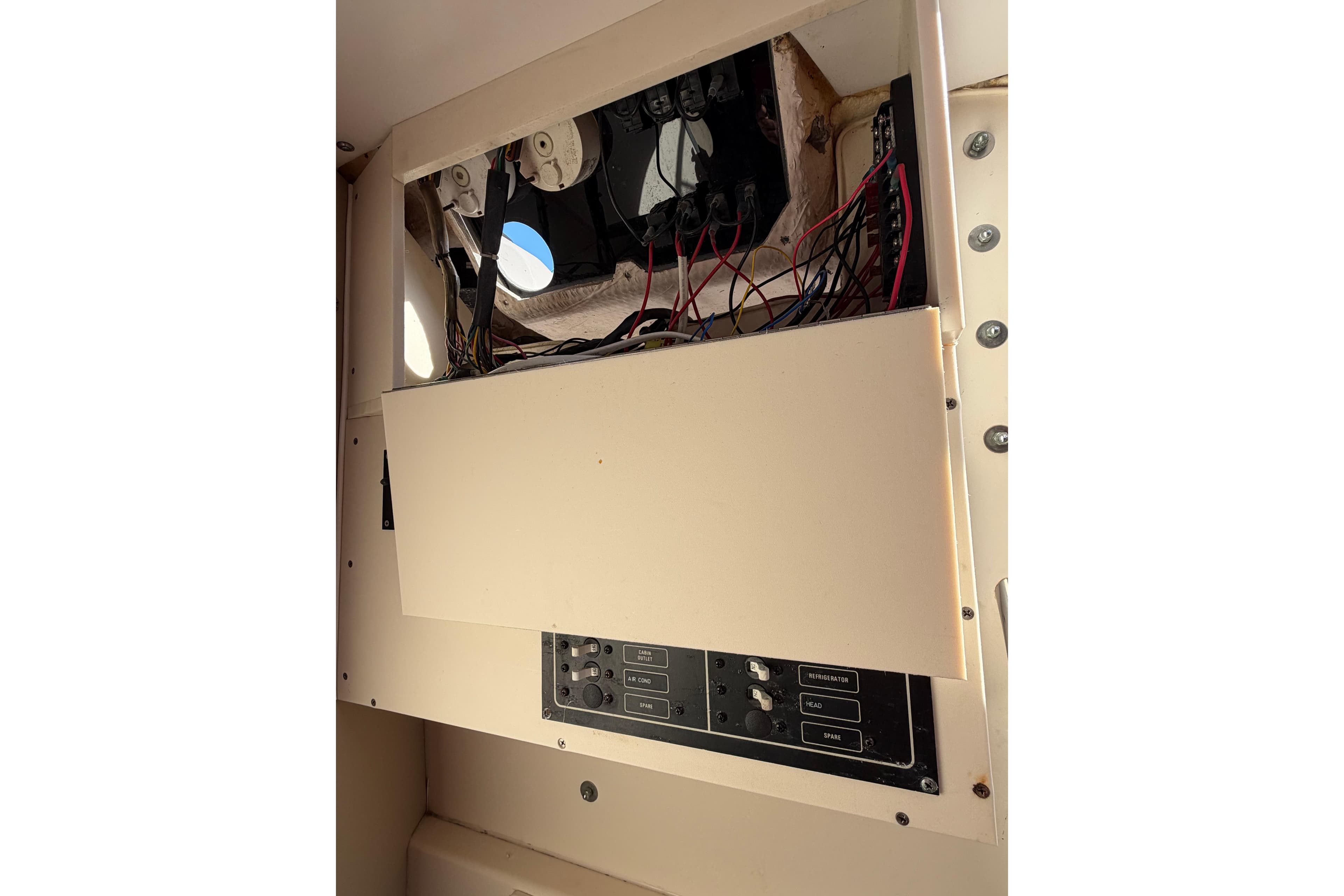 Electrical panel and wiring inside a 1996 Grady-White Marlin 300 boat.