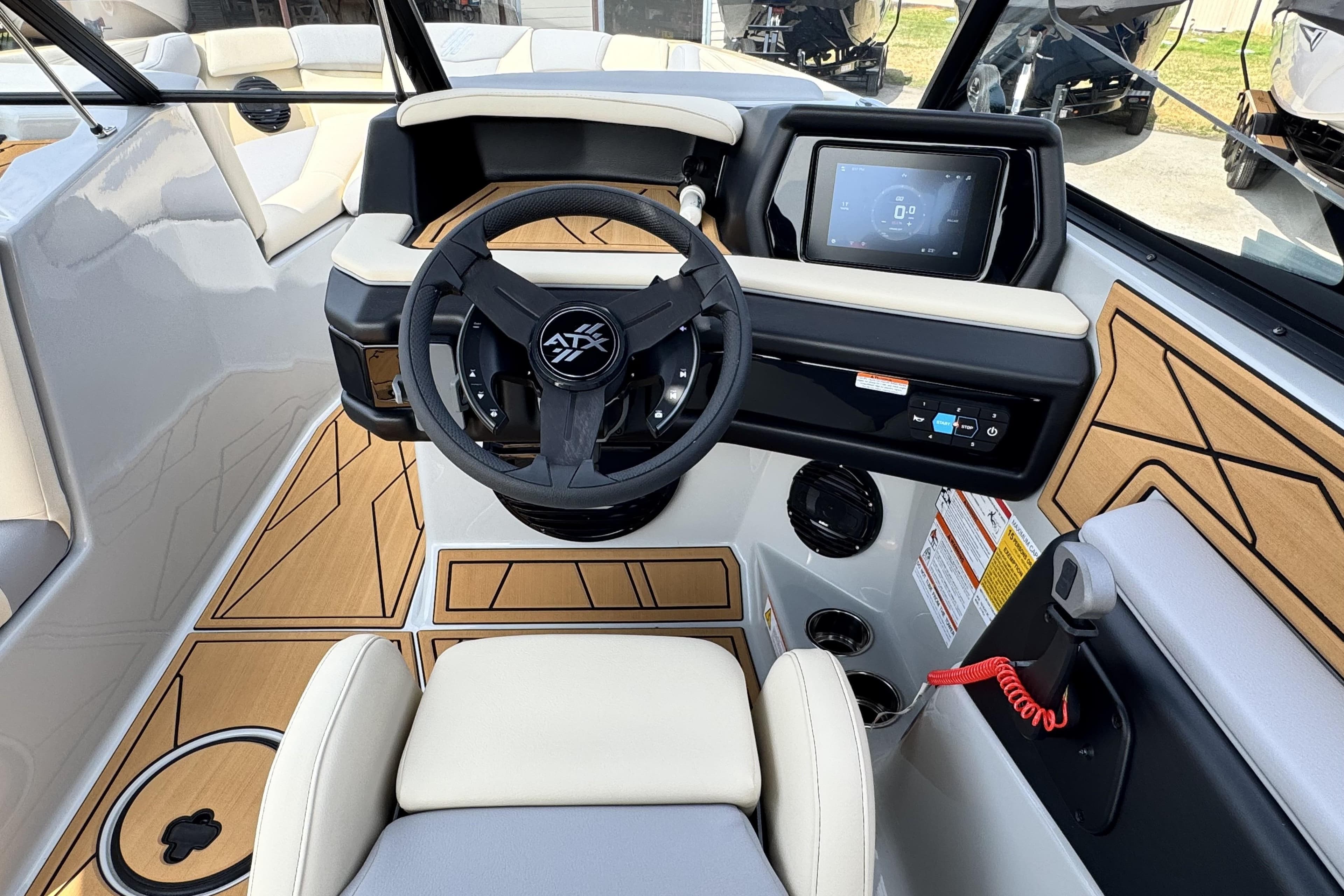 2026 ATX Surf Boats 22 Type-S cockpit with modern steering and digital display.